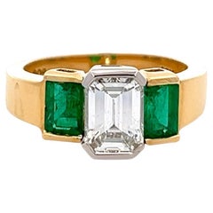 Vintage GIA 1.53 Carats Emerald Cut Diamond Emerald 18k Gold Three Stone Ring