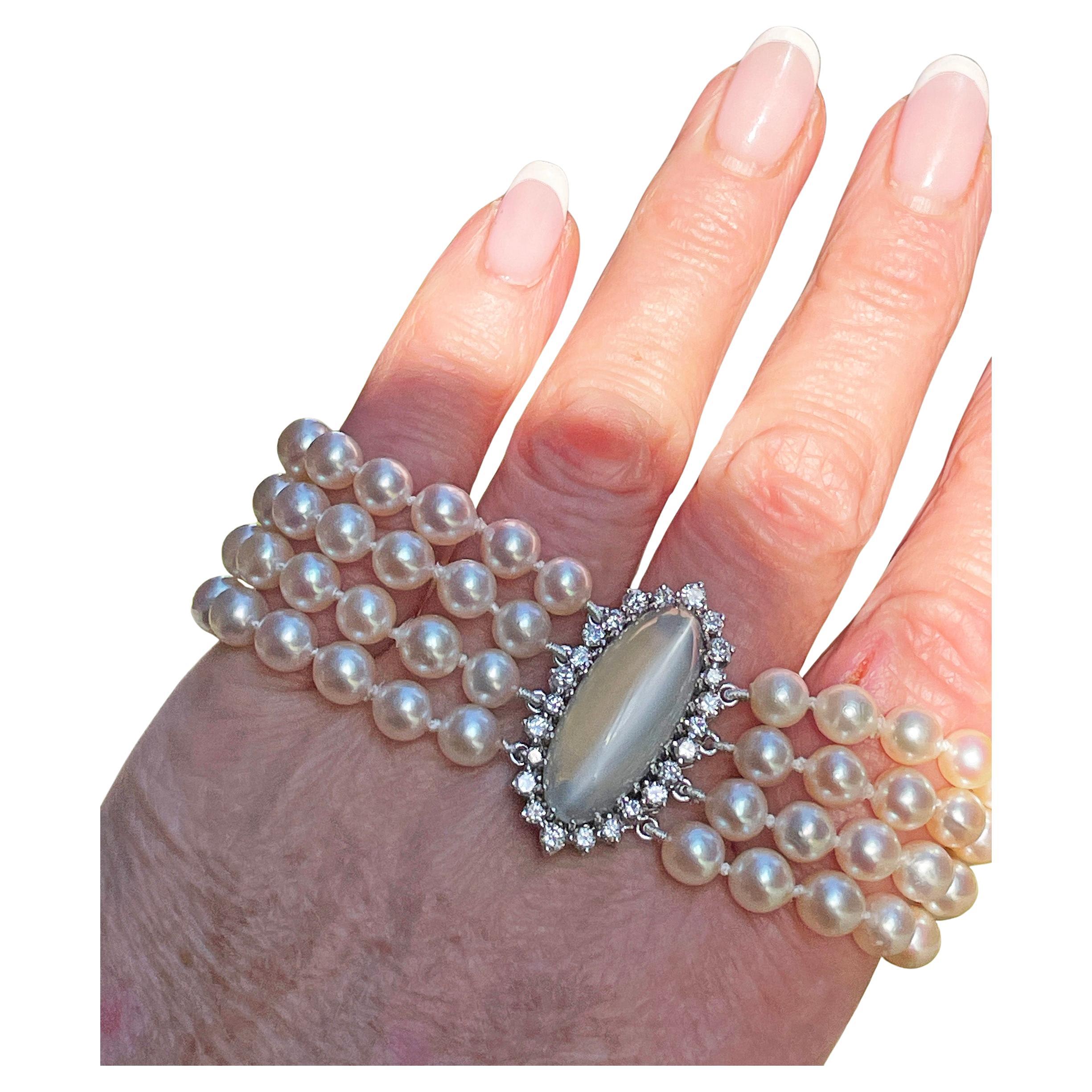 Multi-Strand Vintage Japanese Akoya Cultured Pearl Bracelet GIA 16.50ctw Cat's-Eye Moonstone Diamond 14K White Gold Clasp.

Step into a realm of refined elegance with this jeweled vintage mid-century High-Luster Japanese Akoya 4-Strand Pearl