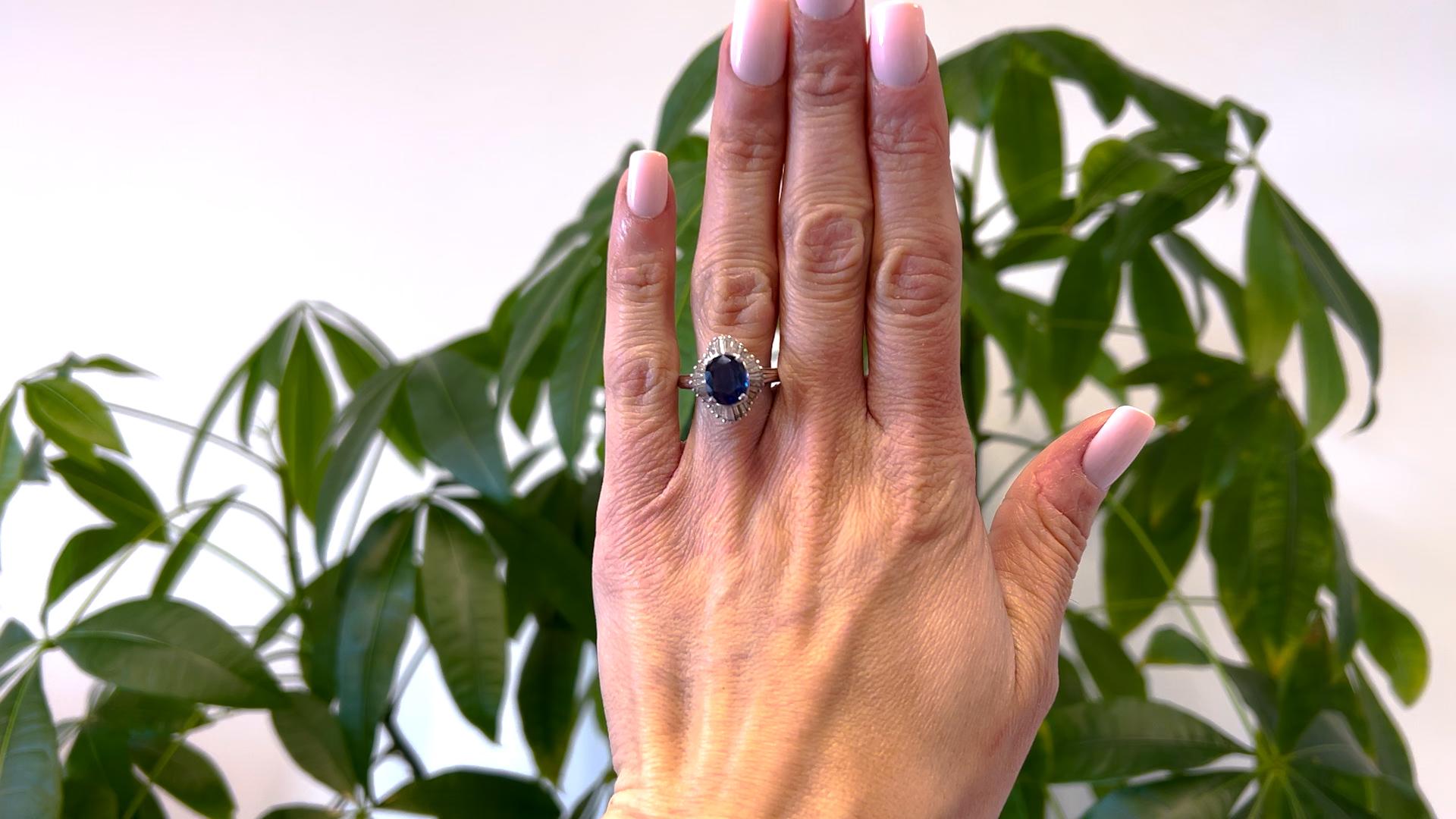 One Vintage GIA 2.97 Carat Ceylon Sapphire and Diamond Platinum Ballerina Ring. Featuring one cushion mixed cut sapphire of 2.97 carats, accompanied with GIA #2231117025 stating the sapphire is of Ceylon (Sri Lanka) origin. Accented by 32 tapered