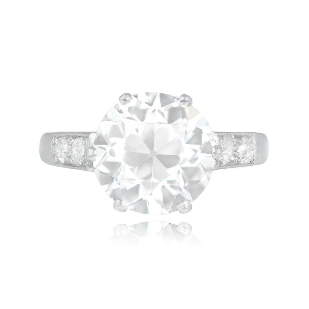 This vintage engagement ring boasts a dazzling old European cut diamond set in prongs. The center diamond is a remarkable 3.42 carat, GIA-certified as I color and SI1 clarity. Along the shoulders, additional old European cut diamonds add to the