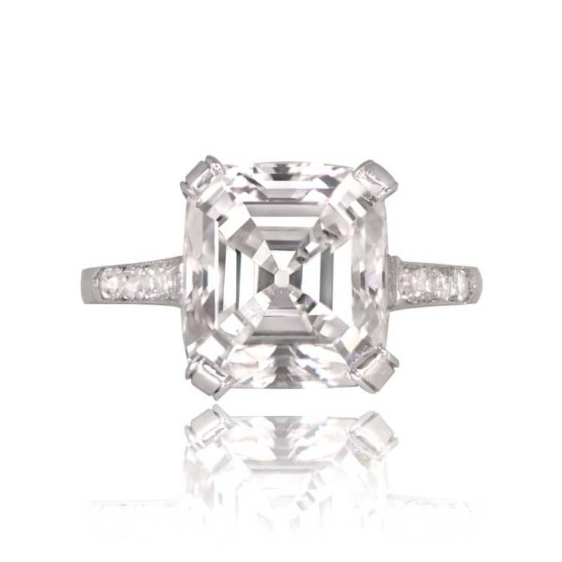 A stunning vintage ring featuring a lively 4.09-carat emerald-cut diamond at its center with a GIA certification of F color and VS1 clarity. The ring also boasts old-cut diamonds prong-set along the shoulders and on the basket, adding to its vintage
