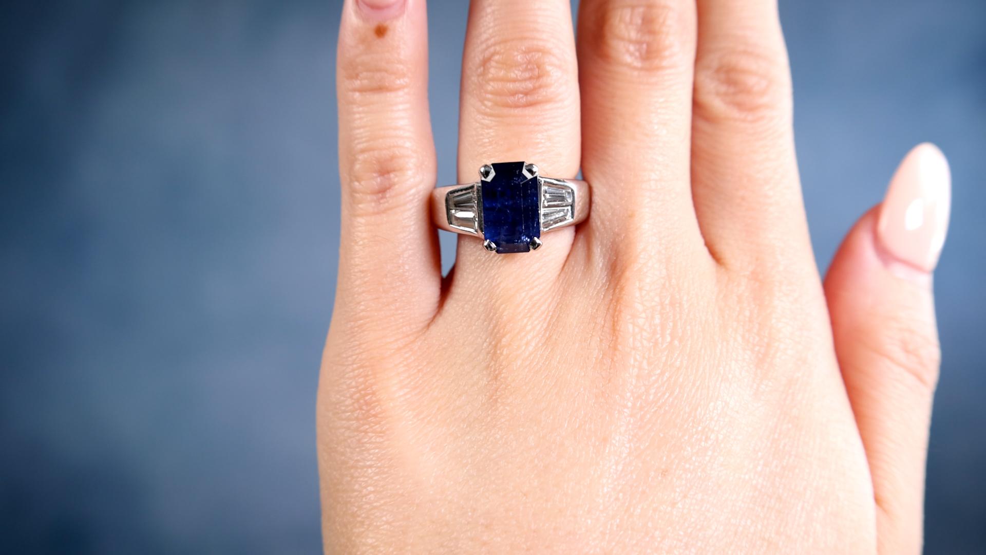 One Vintage GIA 4.71 Carat Ceylon Sapphire Diamond 14k White Gold Ring. Featuring one GIA octagonal step cut sapphire of 4.71 carats, accompanied by GIA #6234196541 stating the sapphire is of Ceylon (Sri Lanka) origin. Accented by four tapered