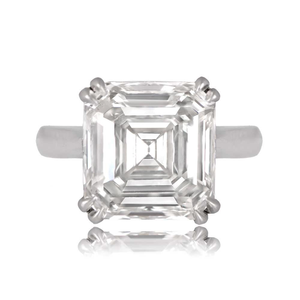 A stunning vintage Asscher-cut diamond engagement ring with a 6.01-carat center diamond, handcrafted in platinum. The ring features double prong settings on the corners, and the central diamond is GIA certified, weighing 6.01 carats with K color and