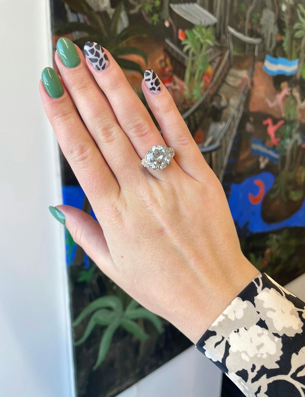 Looking for a statement engagement ring or a solid upgrade? This is the one. Lighten up the room with your striking sparkle and charismatic personality, as you walk in with this show-stopper on your hand. Vintage GIA 7.97 Carat Diamond Platinum