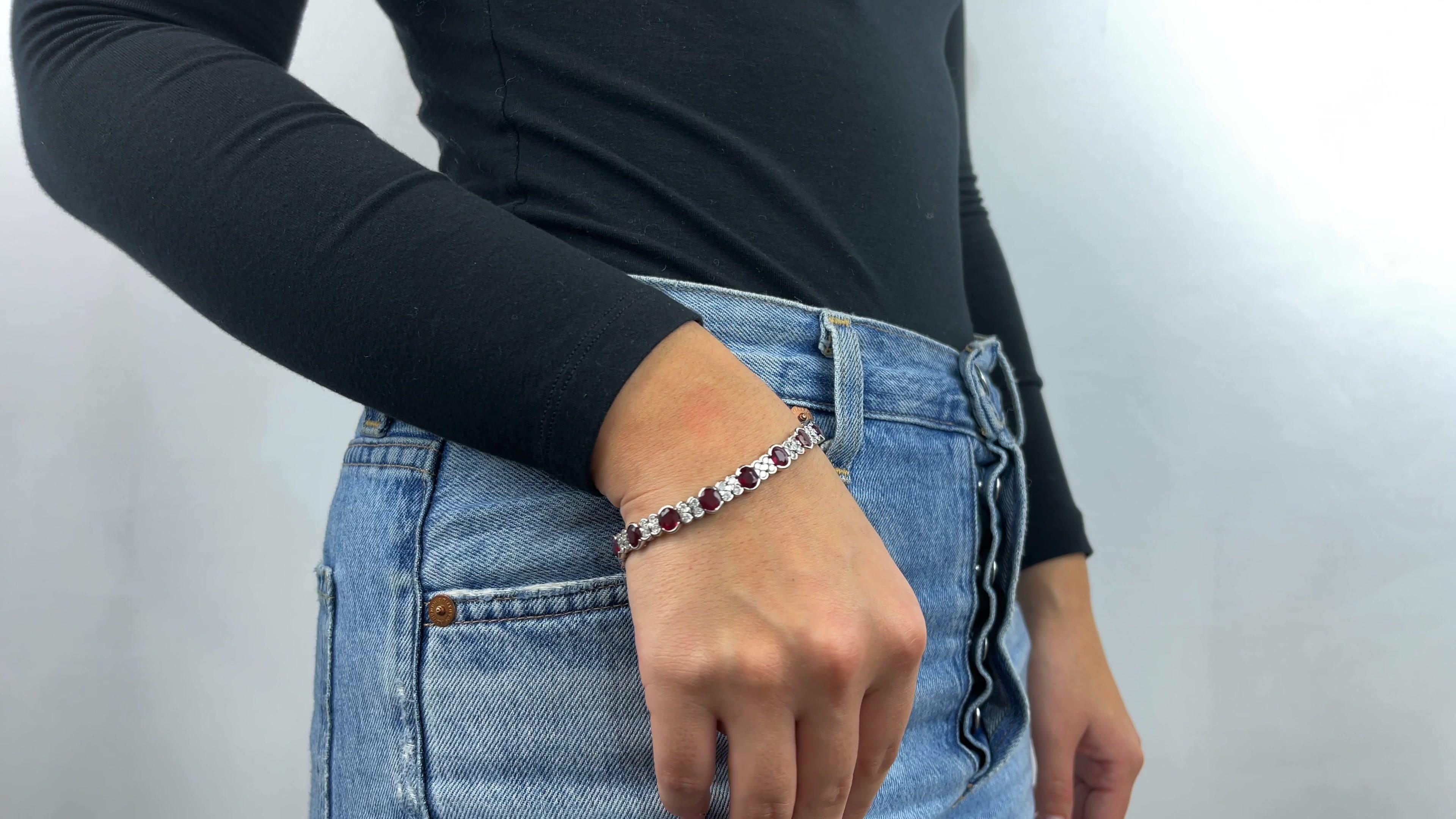 One Vintage GIA Burma Ruby Diamond Platinum Bracelet. Featuring seventeen GIA certified, natural, oval cut rubies accompanied with certificate #1226096186 stating the rubies are of Burma origin and have been heated. Accented by 68 round brilliant