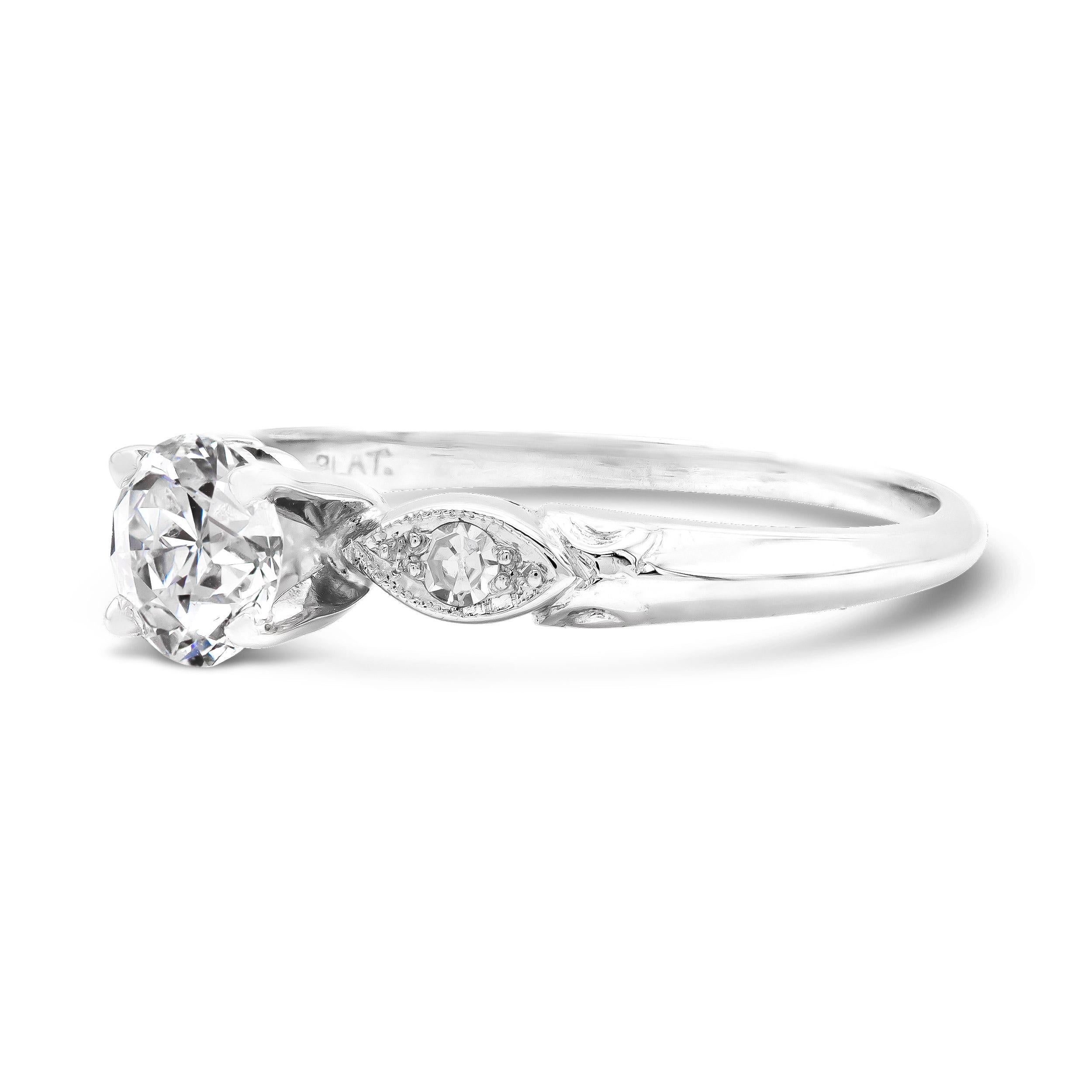It doesn't sweeter than this. A very charming, very white, old Euro centers this vintage engagement ring. The diamond, graded F SI2 by GIA, illuminates the hand. We love the classic four prong basket and sleek marquise-shaped shoulders.

Diamond