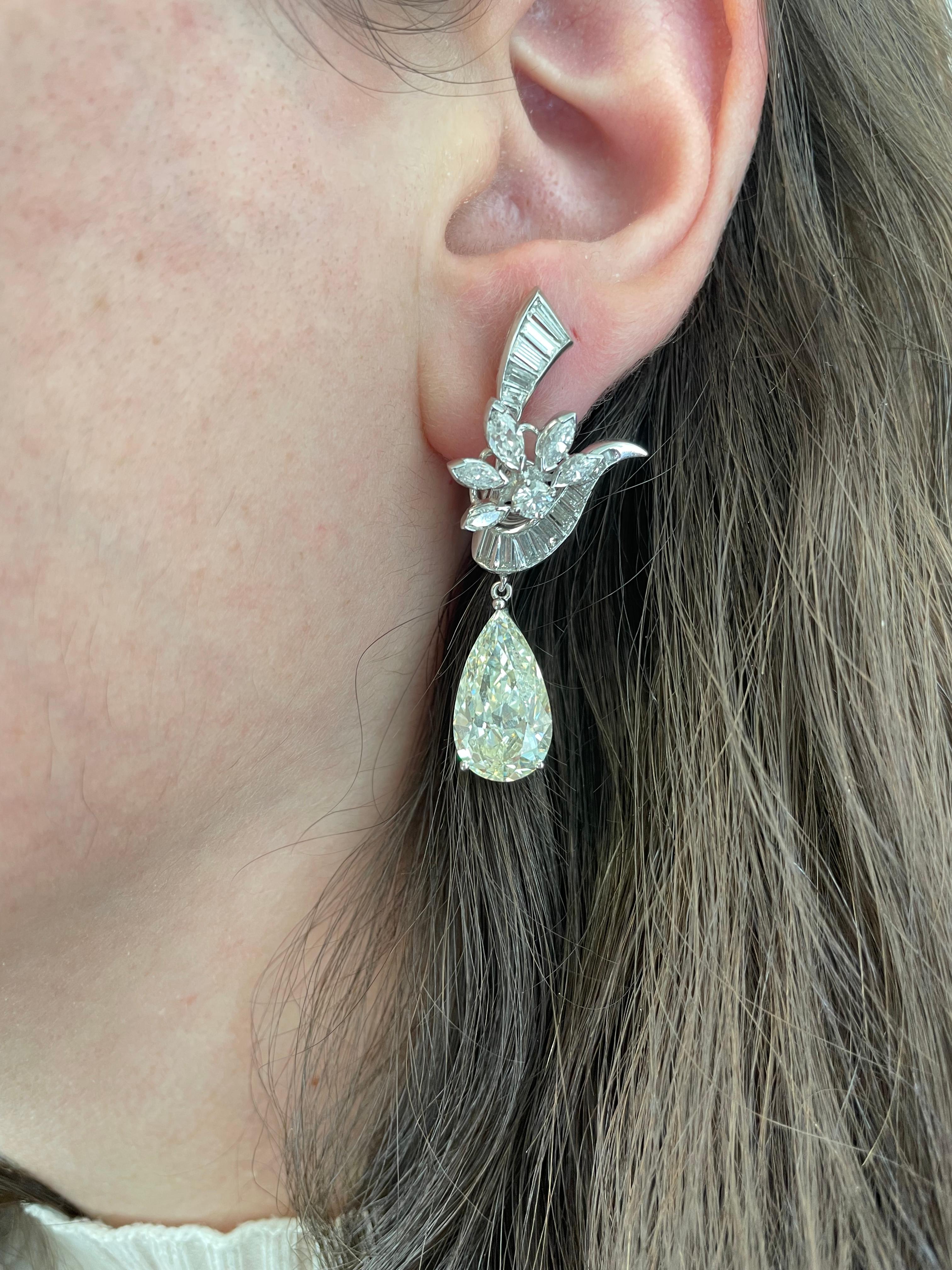 Important vintage GIA certified pear diamond earrings. High jewelry sold by Alexander Beverly Hills. 
2 pear brilliant diamonds, 10.23 carats. Both M color and VS1 clarity GIA certified. Complimented by approximately 4.00 carats of round, marques,