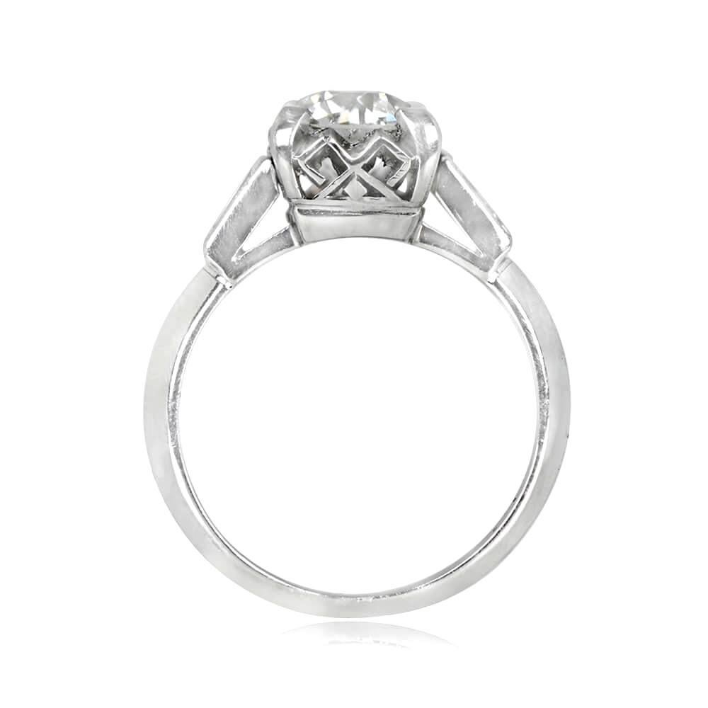 This vintage Art Deco engagement ring boasts a lively 1.06-carat old European cut diamond, certified by GIA with I color and VS2 clarity, elegantly set in prongs. The shoulders of the platinum band are adorned with bezel-set baguette-cut diamonds,