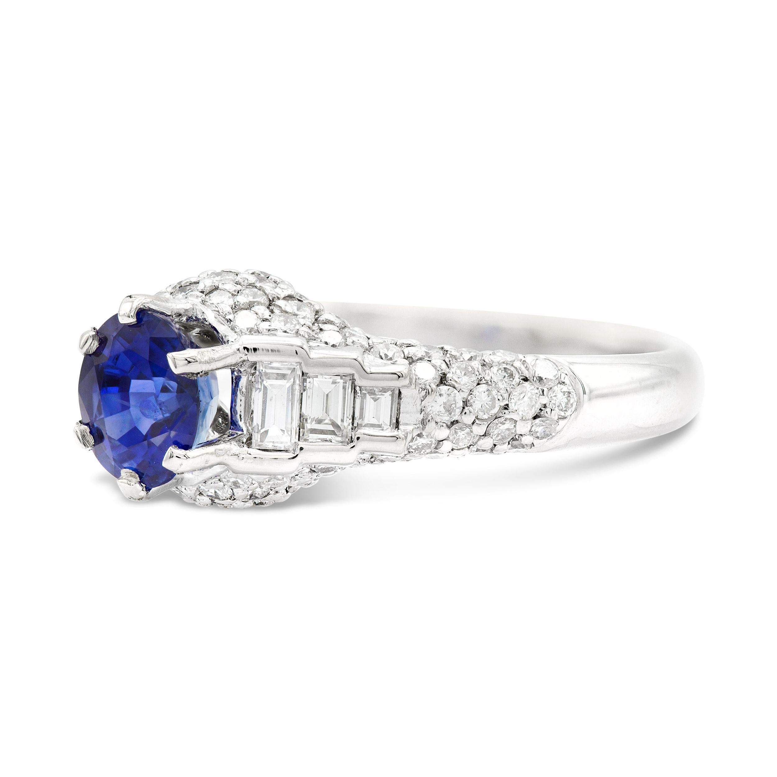 We're so into the deep blue color of the GIA certified oval cut sapphire that centers this vintage ring. A blinged-out look for sure, featuring dozens of diamonds, including some sleek straight baguettes. Sapphires are fit for any and all occasions,