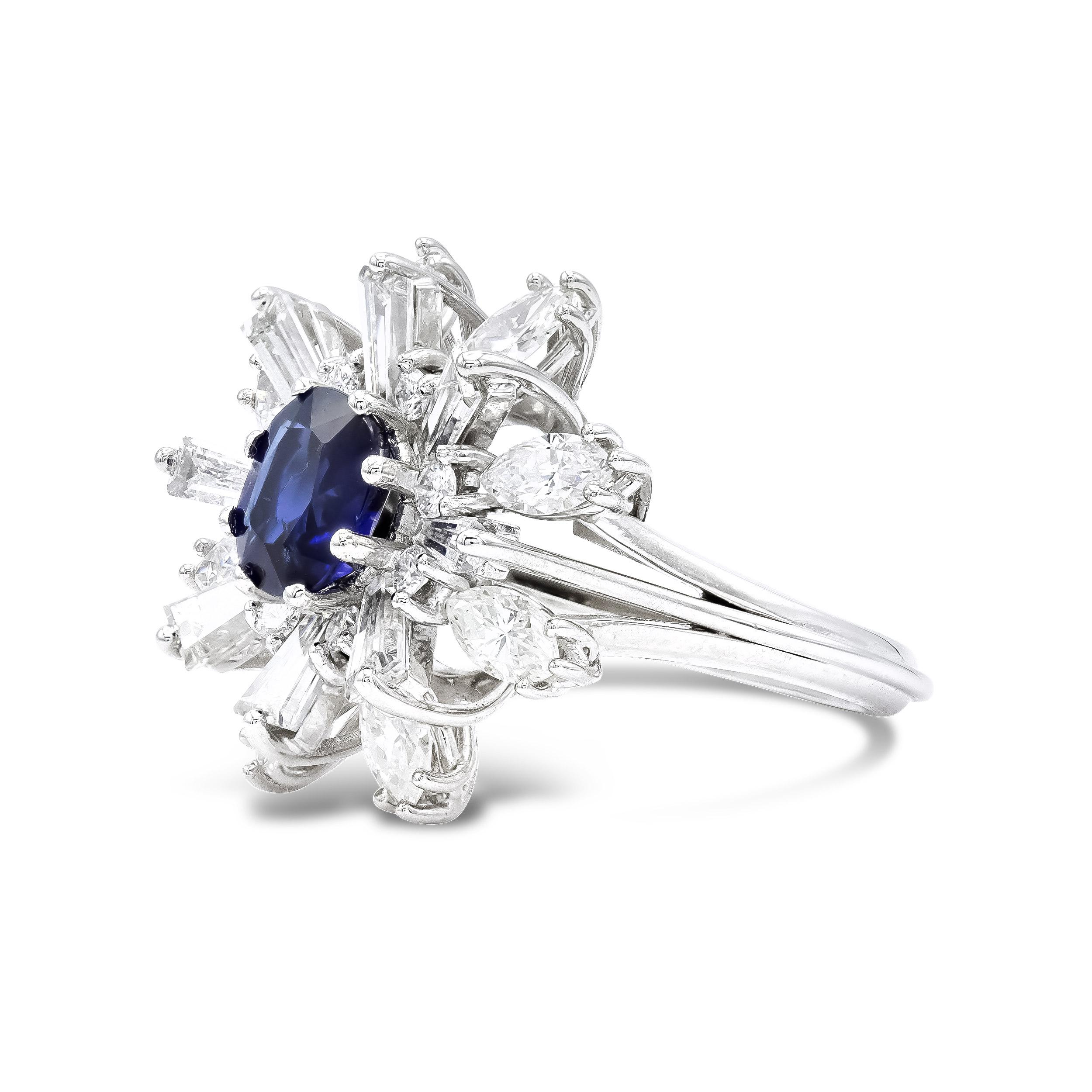A super bold engagement ring or an outstanding cocktail ring. Either way, this piece is all glamour and would be a stunning addition to any woman's jewelry box. This vintage 'ballerina' setting is centered by a deep-hued oval cut sapphire set in