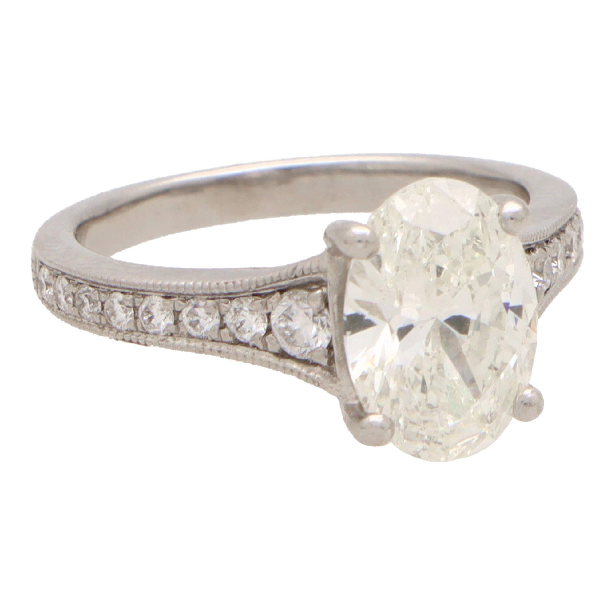 Modern Vintage GIA Certified 2.01ct Oval Cut Diamond Ring Set in Platinum For Sale