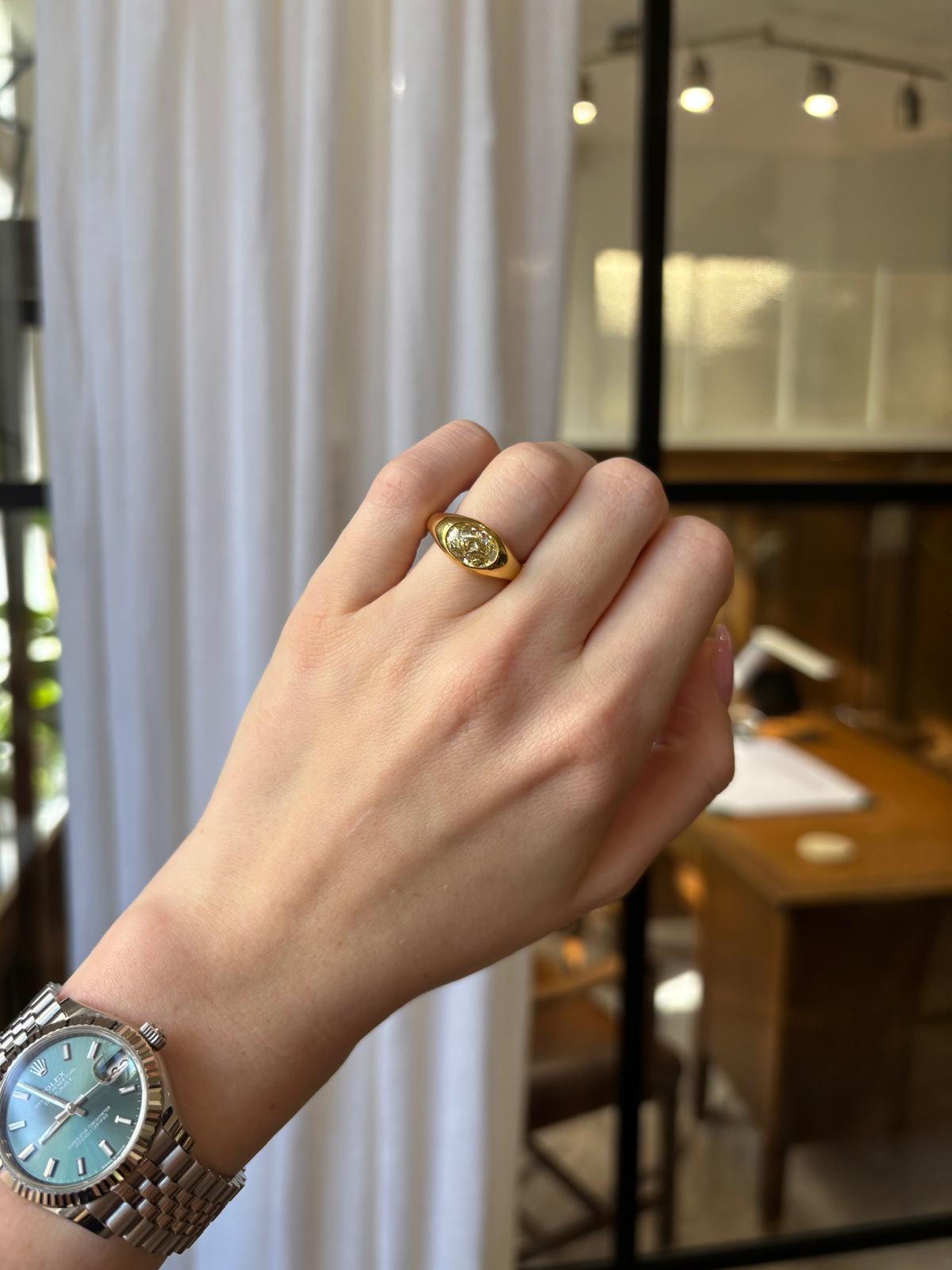 Vintage GIA Certified 2.03ct Fancy Yellow Oval Diamond Bezel Set Ring For Sale 7