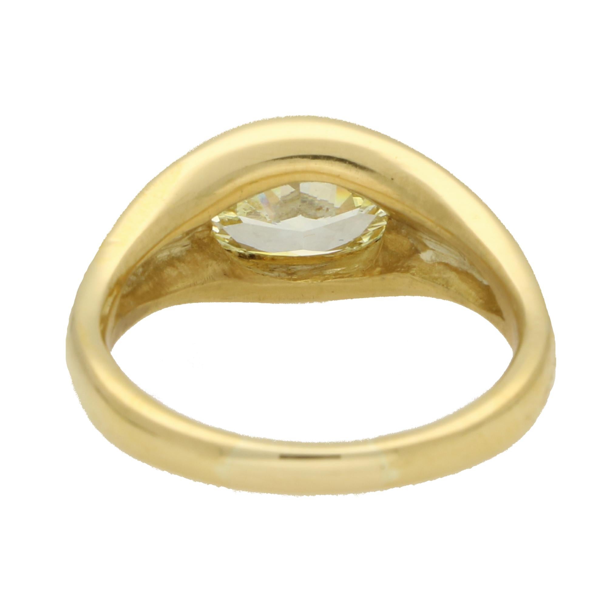 Vintage GIA Certified 2.03ct Fancy Yellow Oval Diamond Bezel Set Ring For Sale 1