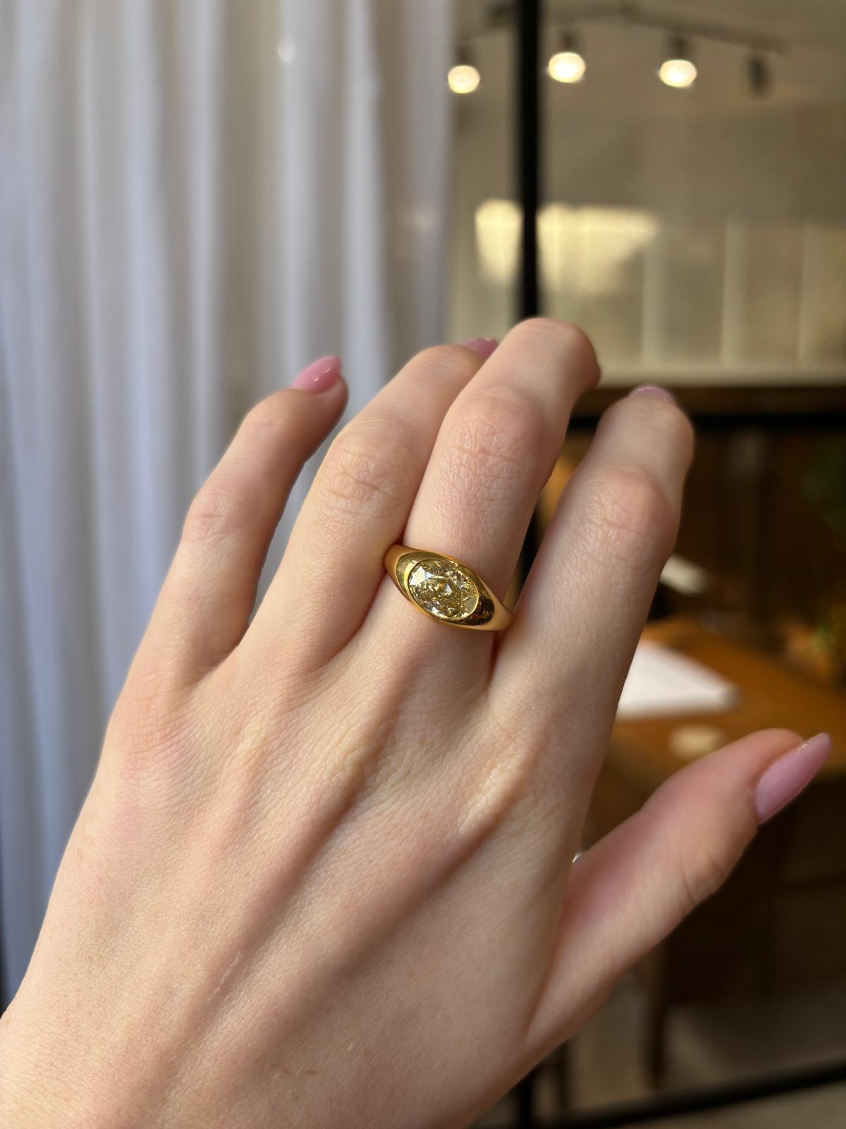 Vintage GIA Certified 2.03ct Fancy Yellow Oval Diamond Bezel Set Ring For Sale 4