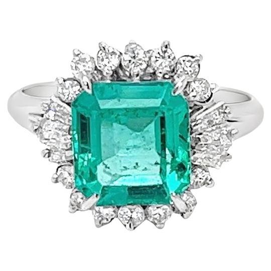 Vintage GIA Certified 2.38 Carat Colombian Emerald and Diamond Halo Ring