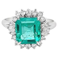 Vintage GIA Certified 2.38 Carat Colombian Emerald and Diamond Halo Ring
