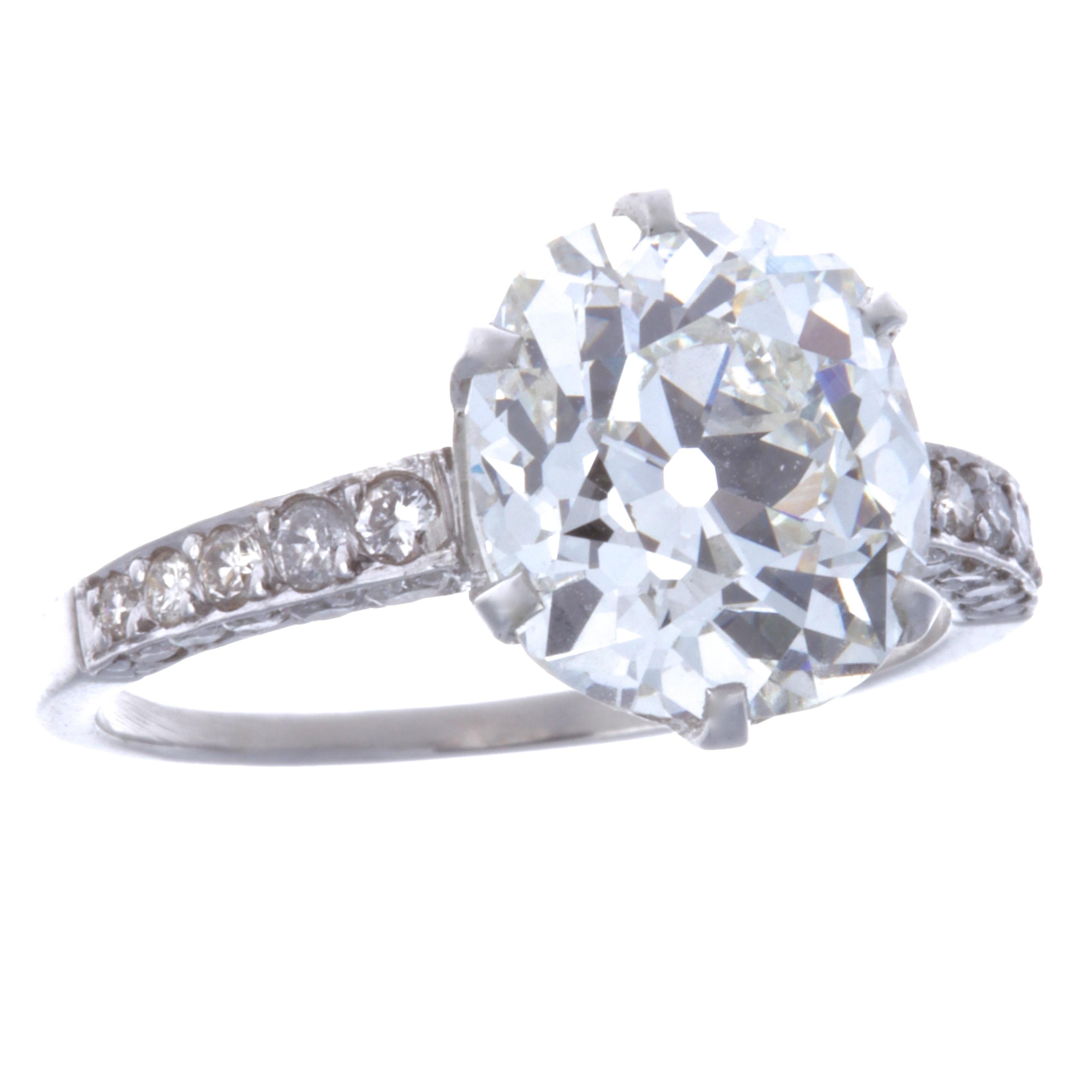 The ultimate Vintage engagement ring. The perfect diamond, the setting and the stunning band, all make a dream engagement ring. No matter where you go, this ring is definitely eye-catching. This GIA certified diamond platinum ring features an