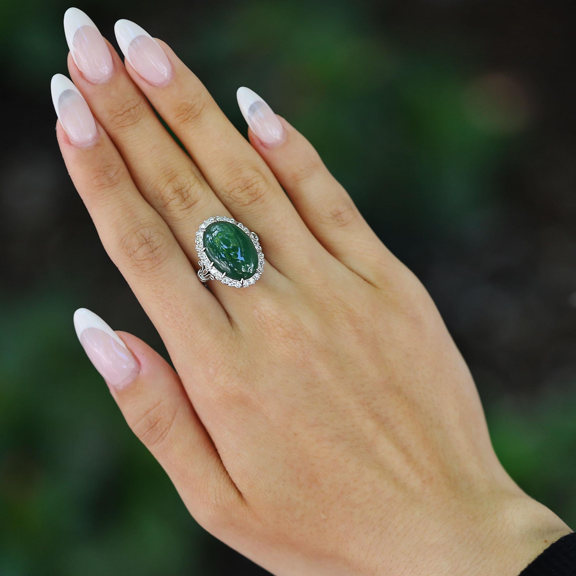 A hand crafted platinum Art Deco revival imperial jade cocktail ring. This impeccable masterpiece features a magnificent jadeite, cut en cabochon, and certified by the GIA Laboratory as untreated. The tiger striped gem is surrounded by 3/4 carats of