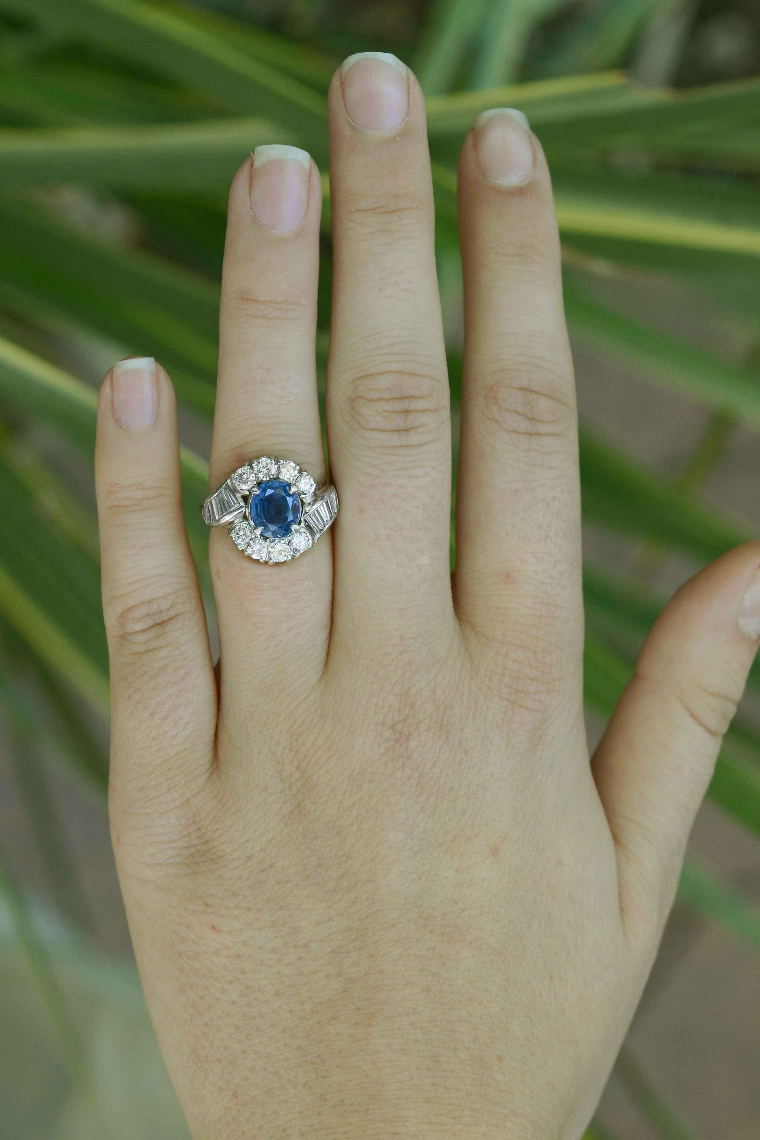 This articulately designed vintage 1960s cocktail ring is a marvel, featuring an attractive free-flowing arrangement of blazing diamonds complete with a world-renowned , unheated Burmese sapphire. Apart from its reputable origin, this vivid, velvety