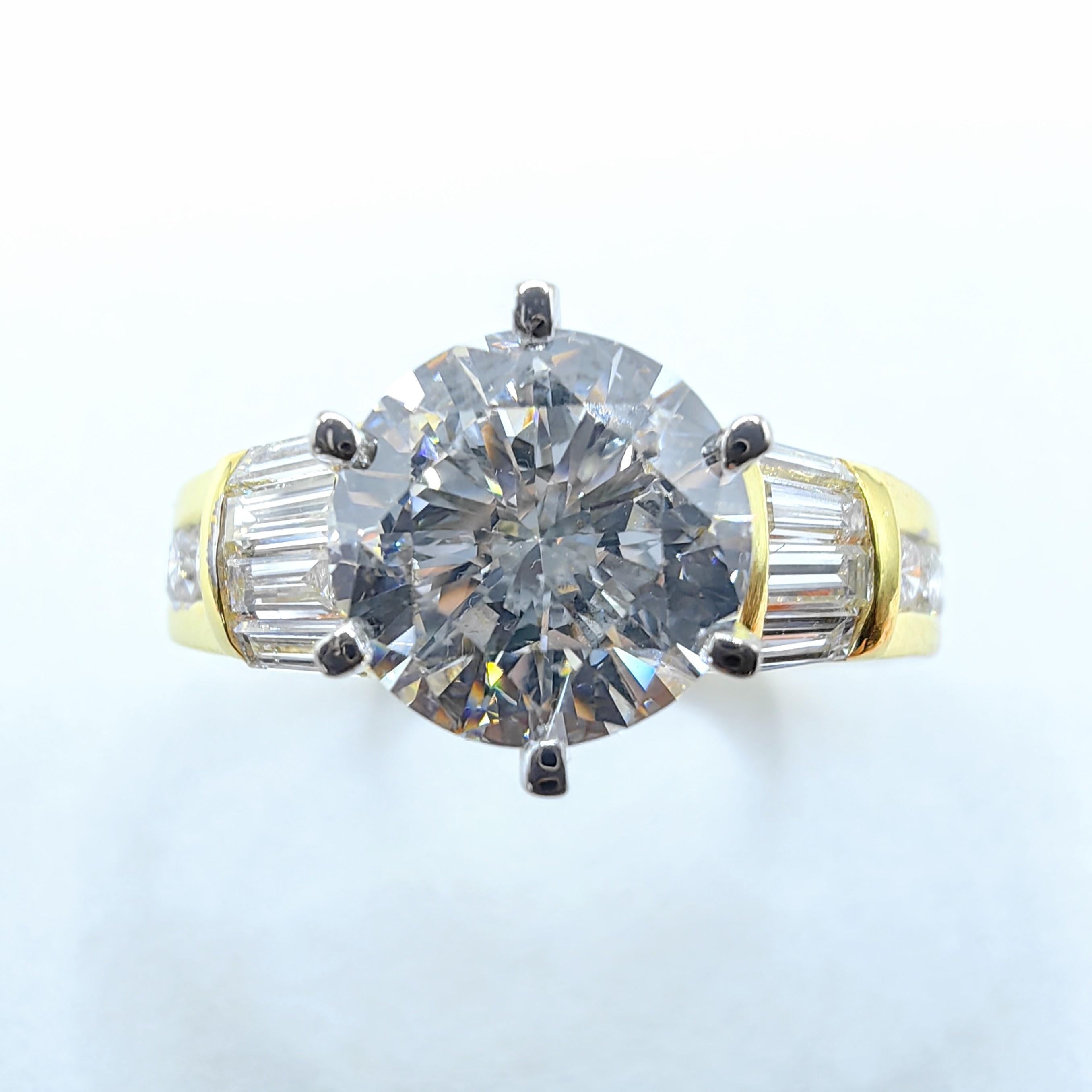 Discover the allure of vintage luxury with this 1980s Art Deco-inspired Diamond Ring in 18k Yellow Gold, where timeless design meets exceptional craftsmanship. The stunning centerpiece is a GIA-certified 1.50-carat round-cut diamond (F color, SI1
