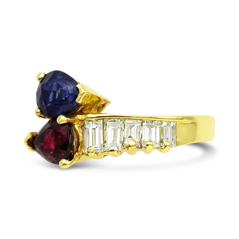 We never met a toi et moi ring and this retro number is no exception. Two pear cut GIA graded gemstones, one sapphire and the other ruby, pair together so well and the accompanying straight baguette diamonds are just the cherry on top. This ring