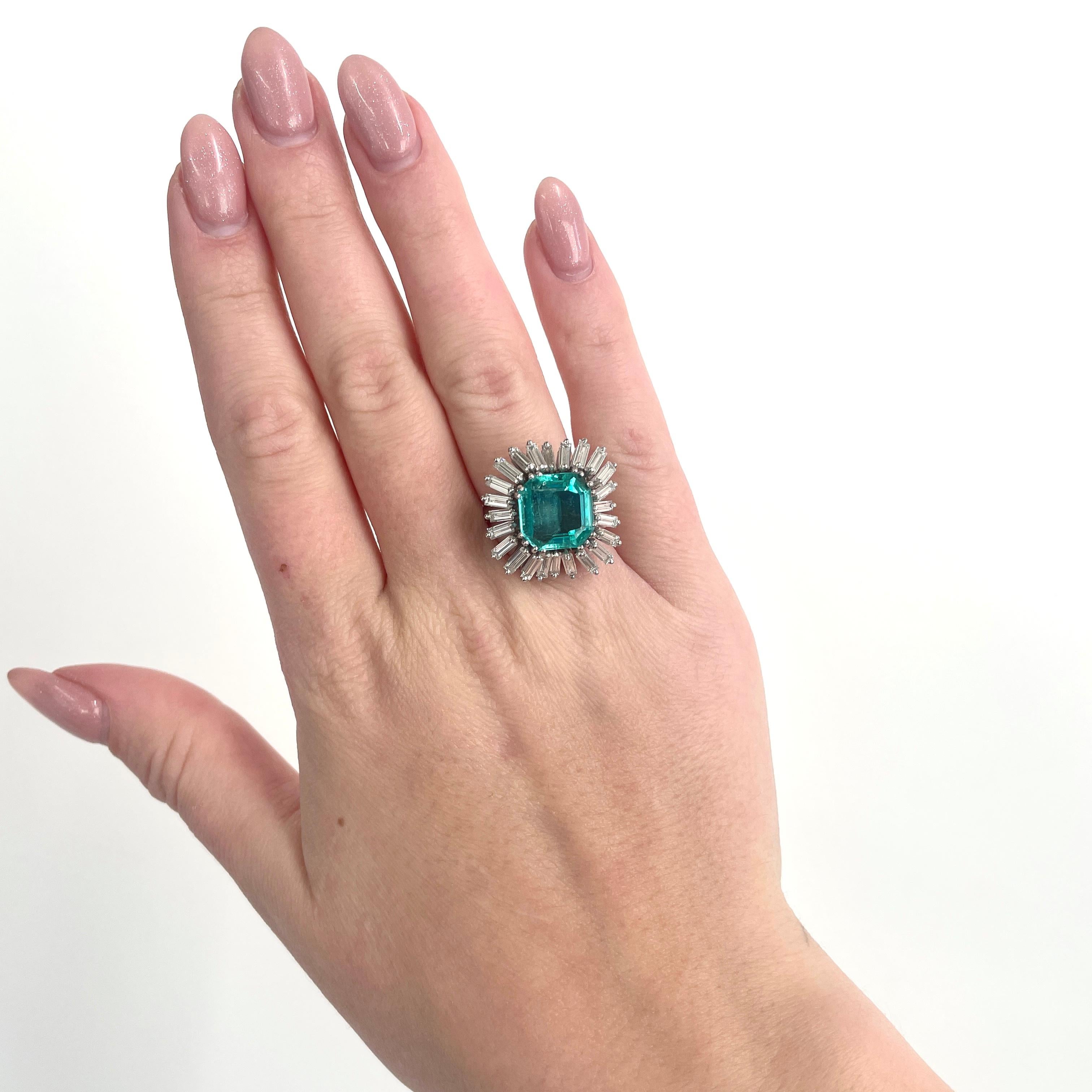 Make a statement as you walk into the room. This striking vintage emerald and diamond ring will not let you go unnoticed at any soiree. Radiate your sparkle and confidence. This is a Vintage GIA certified Columbian Emerald Diamond Platinum Ballerina