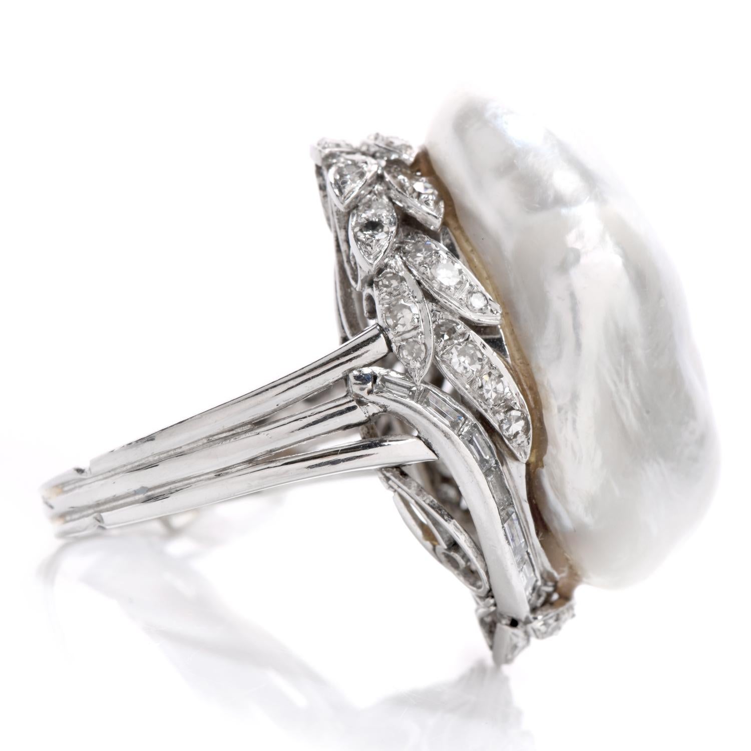 Wear this memorable ethereal Diamond & Baroque Pearl Platinum ring at your next formal occasion. 

This whimsical ring boasts one large spectacular 26 mm x 17 mm white saltwater pearl. 

Forty-Eight round cut, and 15 baguette cut genuine diamonds,