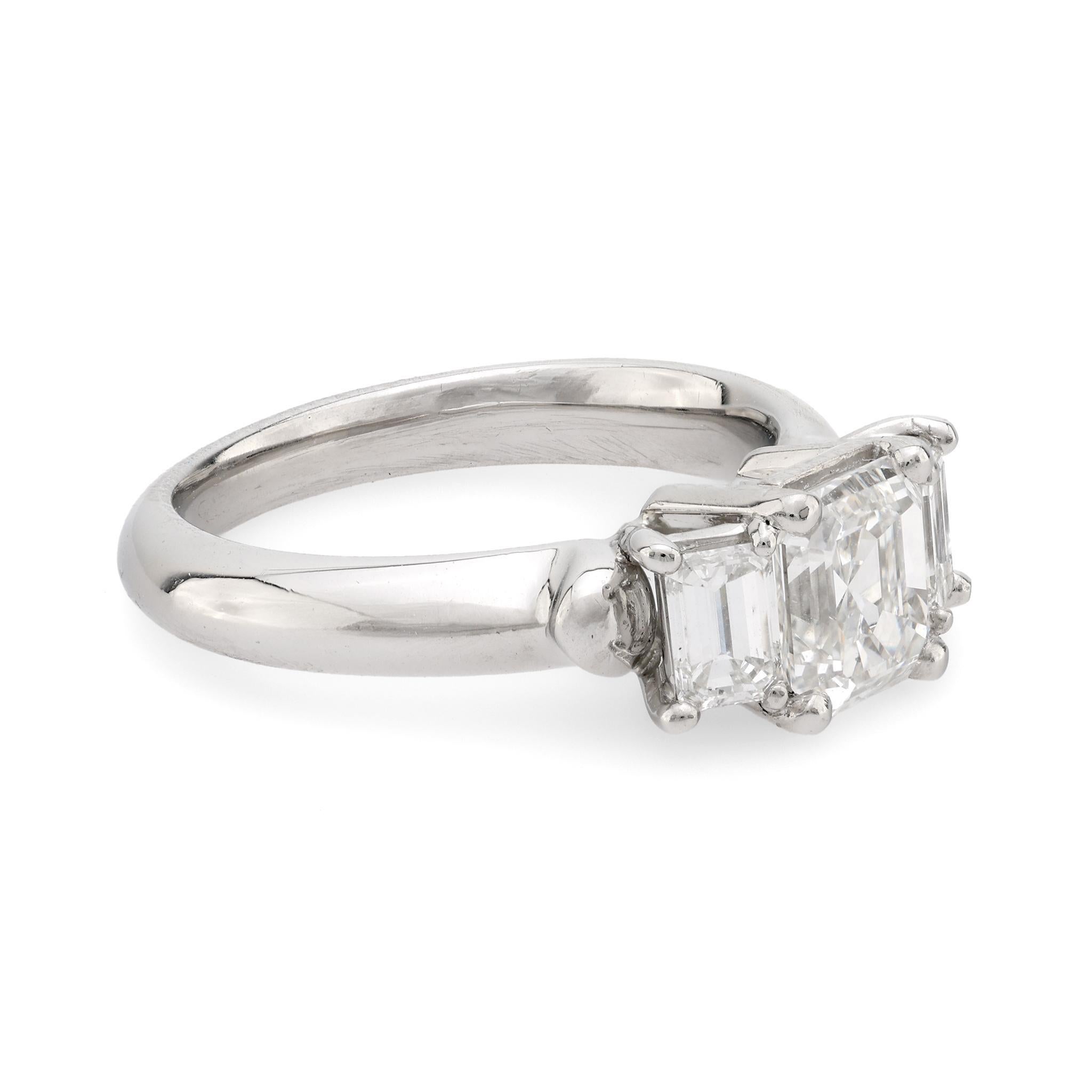 Modern Vintage GIA emerald cut diamond platinum three stone ring