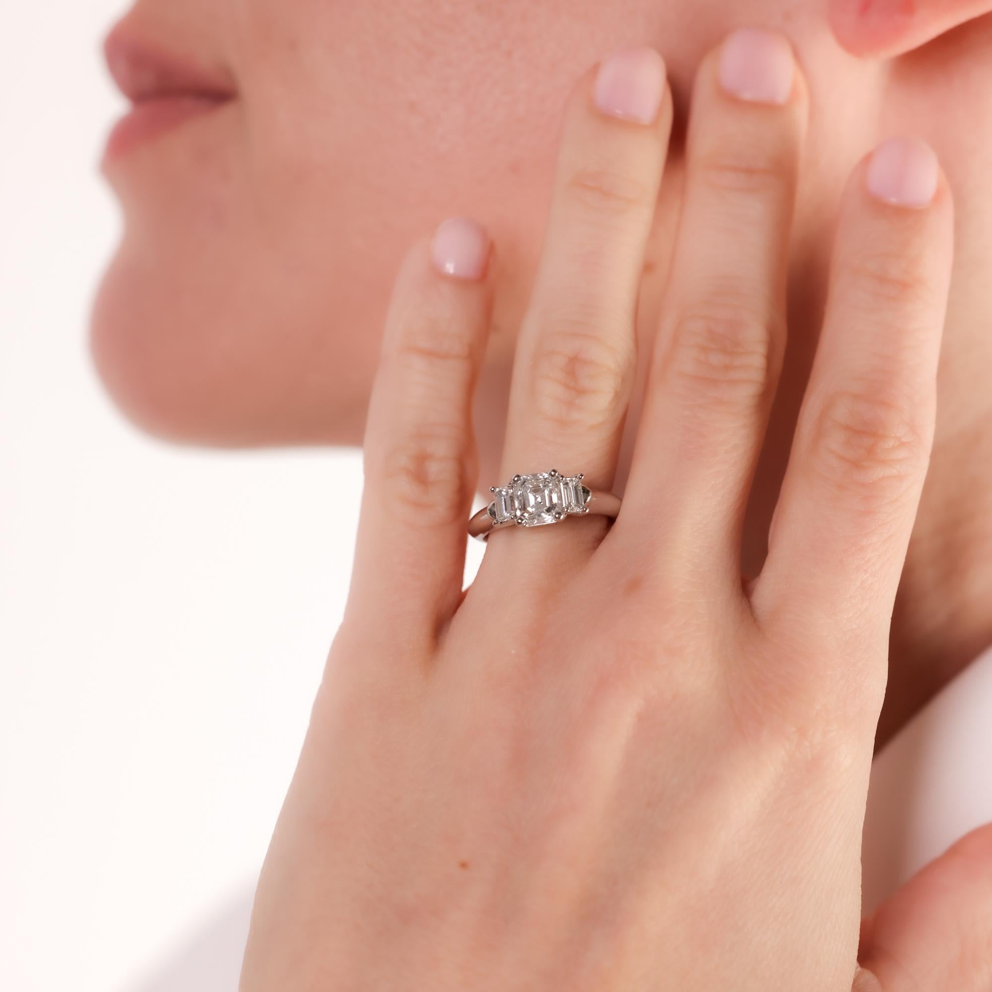 Emerald Cut Vintage GIA emerald cut diamond platinum three stone ring