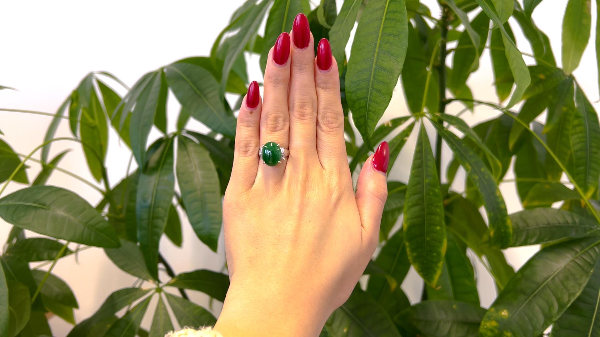One Vintage GIA Jade and Diamond Platinum Ring. Featuring one GIA cabochon cut jadeite jade weighing approximately 4.10 carats, accompanied with GIA #1236122070 stating the jade is natural color with no indications of impregnation. Accented by four