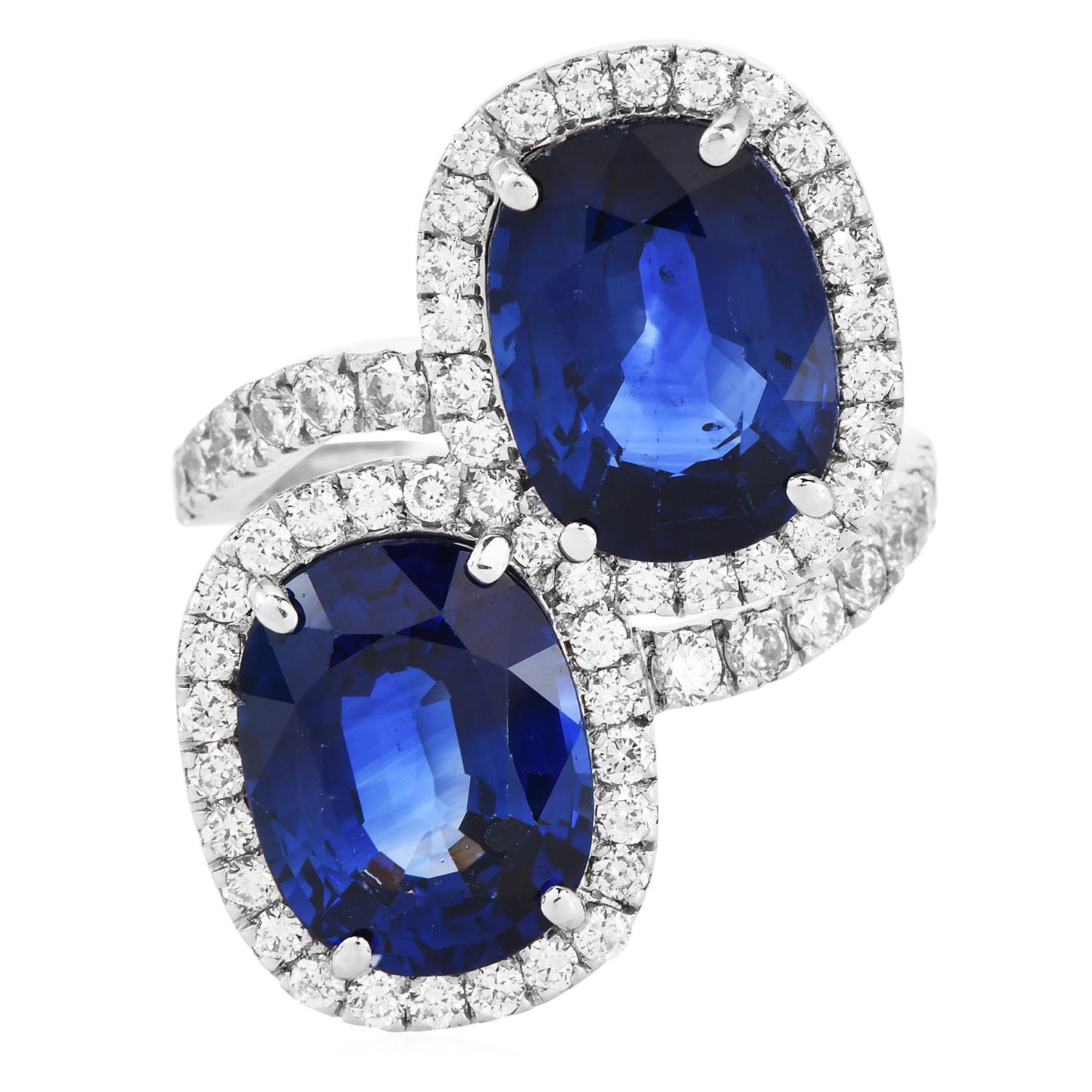 Discover the exquisite beauty of this Vintage Sapphire and Diamond Halo Bypass Engagement Ring.

Perfect for those who cherish sophisticated elegance with a splash of vibrant color, this ring is an unforgettable choice for a proposal.

Luxurious