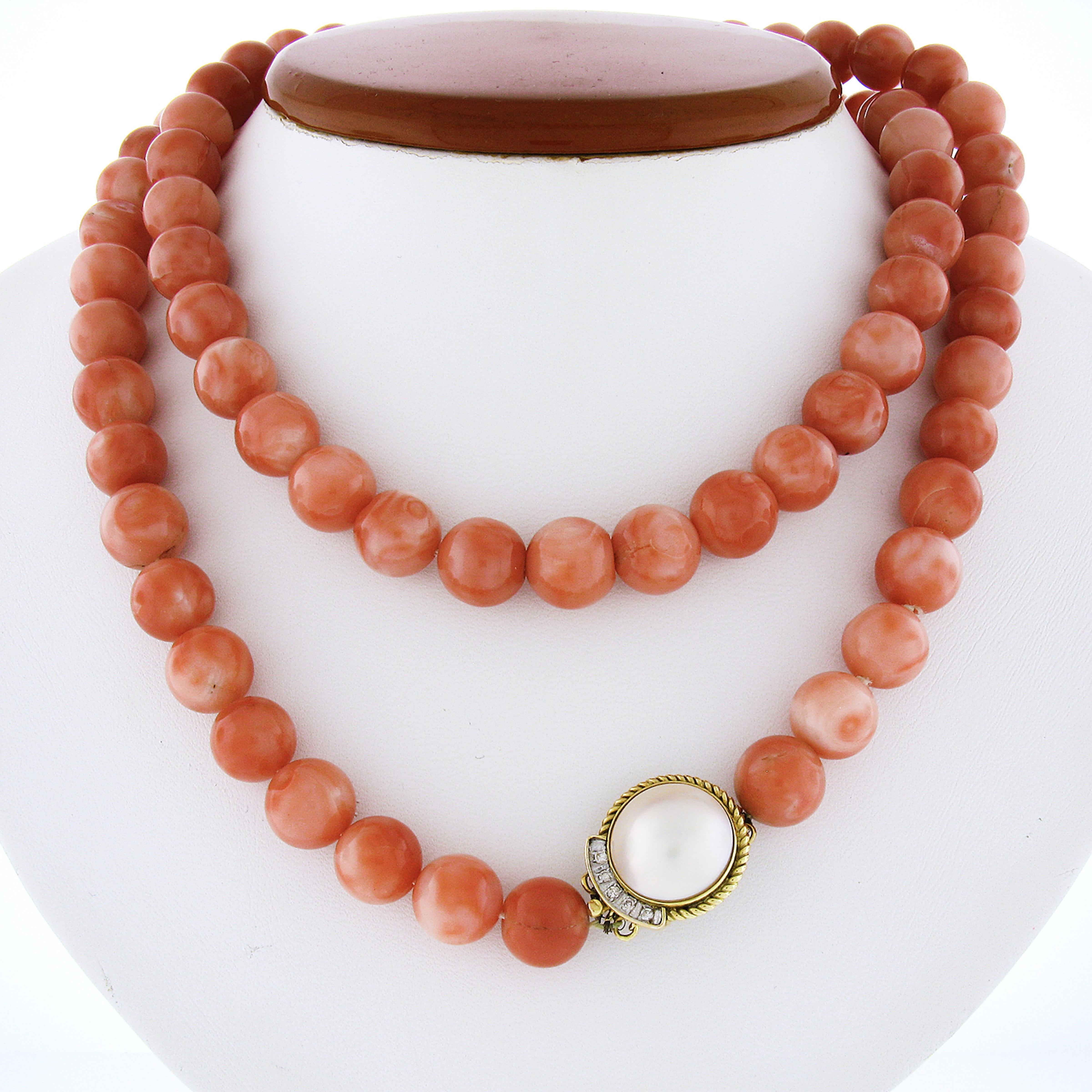 This magnificent vintage strand necklace features gorgeous natural coral beads neatly strung throughout. The lovely coral are GIA certified (2 beads were chosen at random for testing) as being 100% natural showing a beautiful red-orange color with