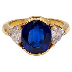 Vintage GIA Thai 4.46 Carat Sapphire and Diamond 18k Gold Three Stone Ring