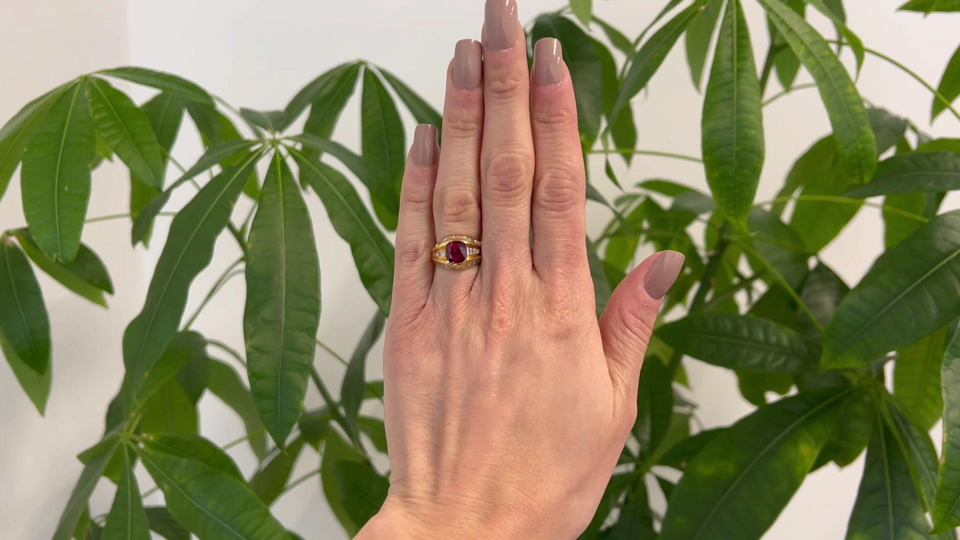 One Vintage GIA Thailand Ruby Diamond 18 Karat Yellow Gold Dome Ring. Featuring one GIA ruby weighing approximately 3.20 carats, accompanied with GIA #2221730183 stating the ruby is of Thailand origin. Accented by 30 baguette cut diamonds with a