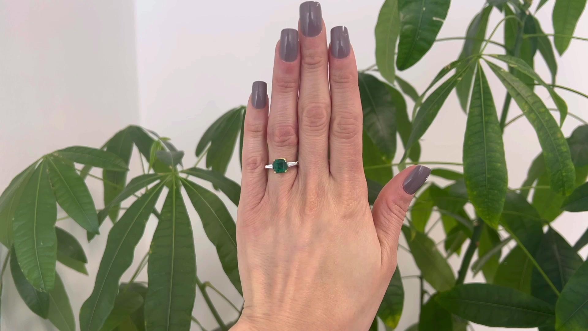 One Vintage GIA Zambian Emerald Diamond Platinum 18 Karat Yellow Gold Ring. Featuring one GIA octagonal step cut emerald weighing approximately 2.15 carats, accompanied with GIA #6223499265 stating the emerald is of Zambian origin. Accented by two