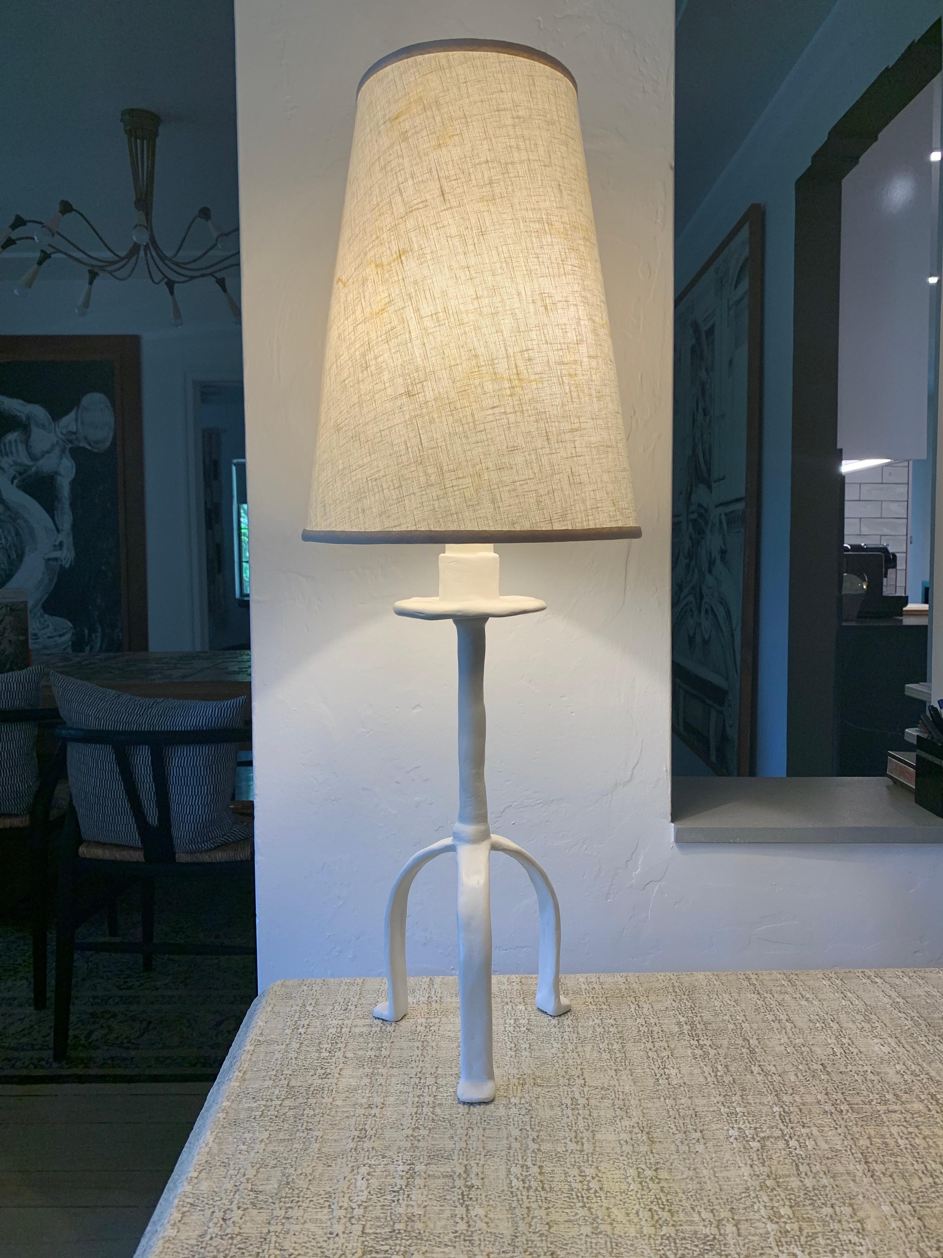Inspired in a tribal design, this Giacometti style plaster over iron lamp with original shade.
Note: Normally the shades are not included, however, if you like the shade, we will include it at no additional cost.
Additional dimensions: Shade is 13