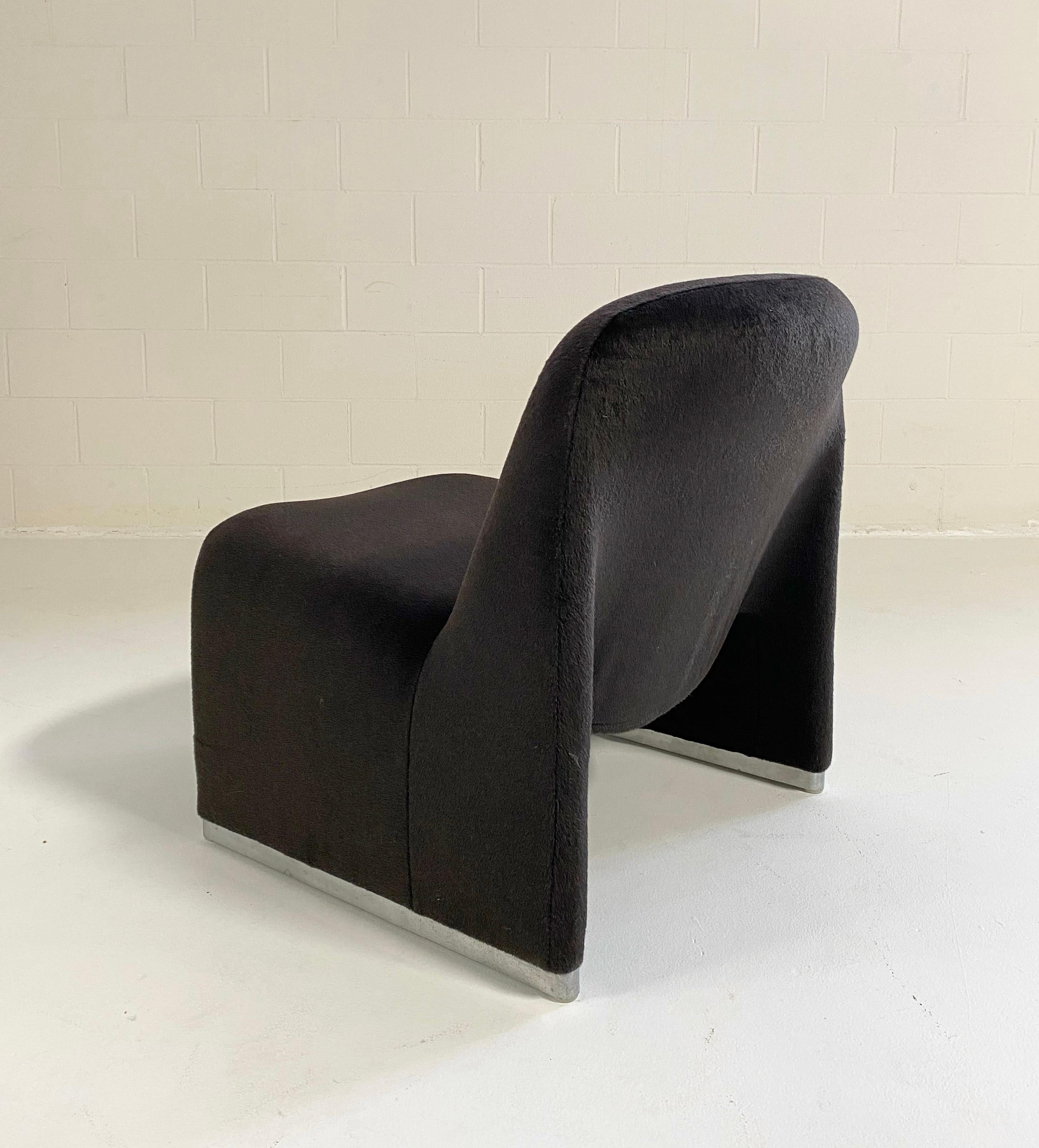 We love the simplicity of the Alky Chair. Our master upholstery team restored the chair with new foam and our designers chose the ultra luxe Loro Piana alpaca and virgin wool fabric in a muted, cozy black noir. Loro Piana fabrics are crafted in