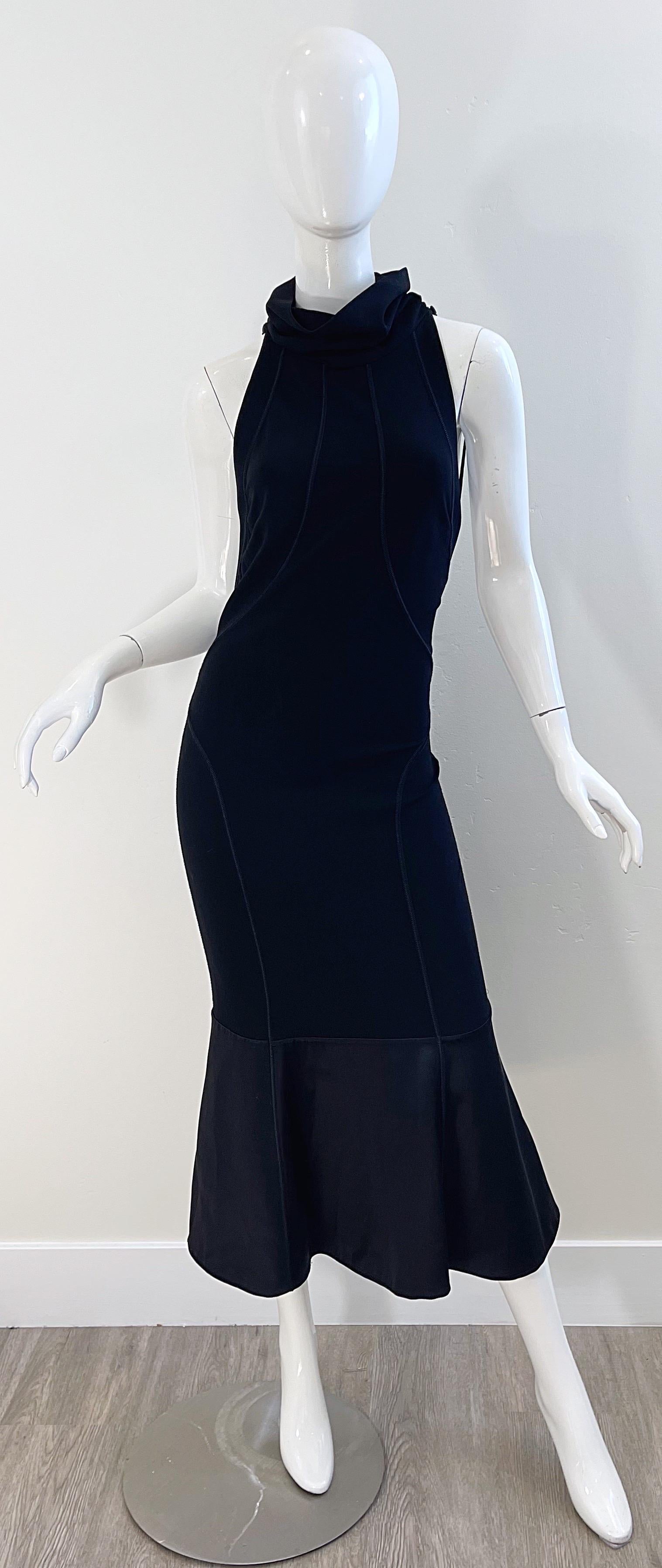 Sexy late 1990s GIANFRANCO FERRE black jersey racerback midi dress ! Features. A draped high neck with a tailored bodice. The back reveals just the right amount of skin. Hidden zipper up the back of the skirt with hook-and-eye closure. 
The perfect