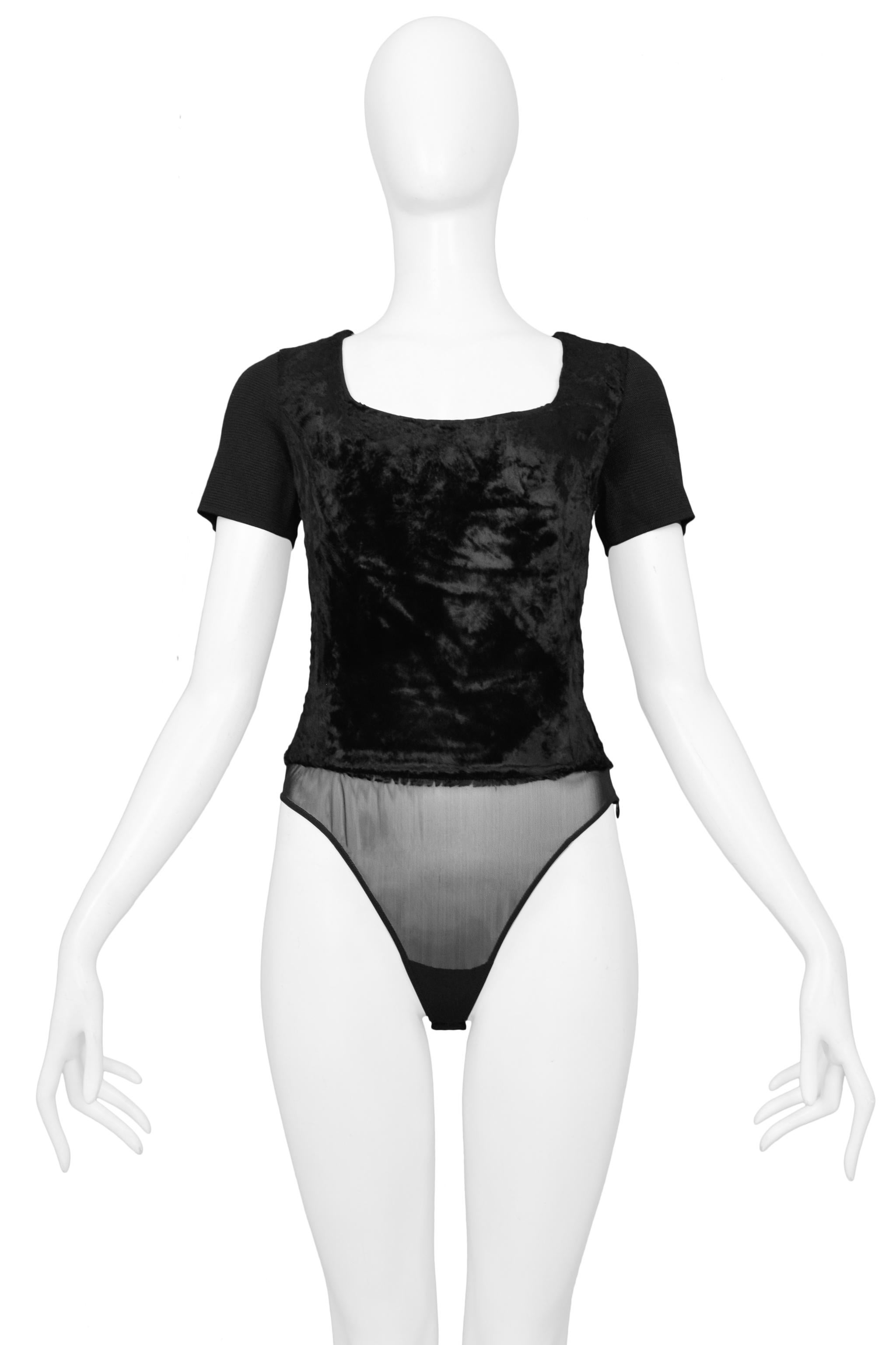 Resurrection is excited to offer a vintage Gianfranco Ferre black velvet bodysuit featuring a scoop neck, short sleeves, snap crotch, sheer bottom, and side zipper. 

Gianfranco Ferre
Size 38
Viscose, Polymide, Elastic
Excellent Vintage Condition