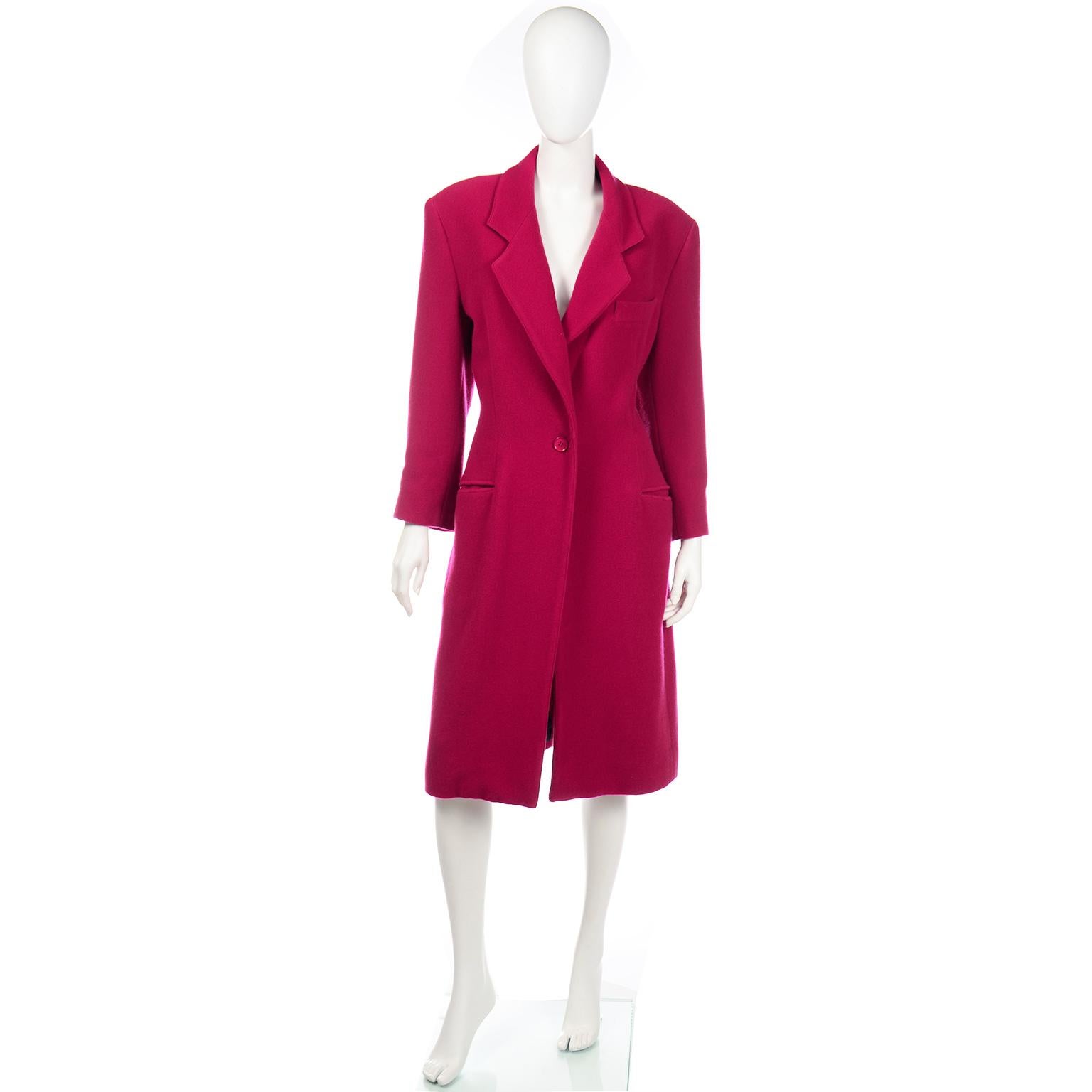 This luxe raspberry Gianfranco Ferre coat is fully lined and feels like a cashmere wool blend. This elegant coat closes with a single button at the waist and has slash hip pockets.  We love Gianfranco Ferre and especially love the rich color of this
