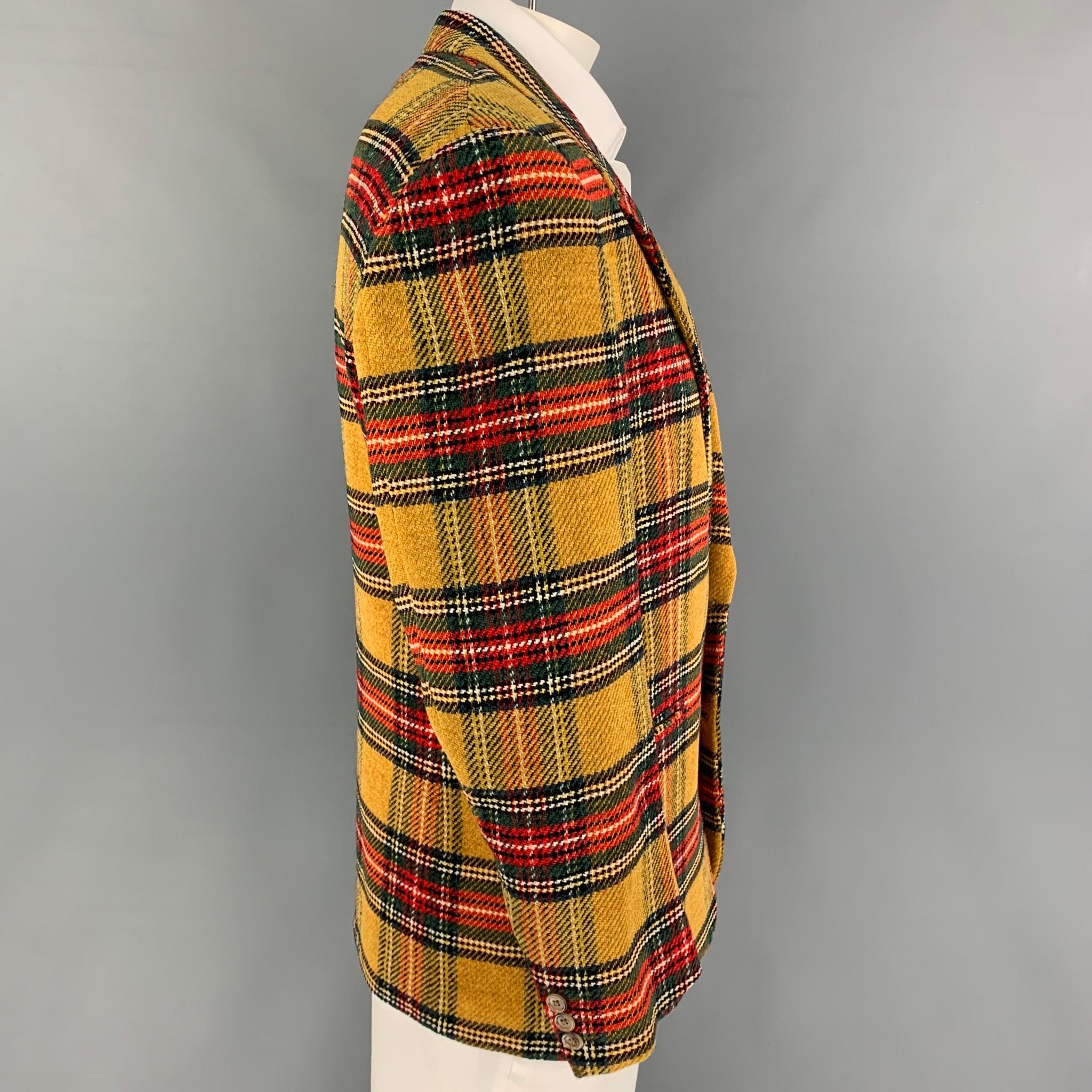 Vintage GIANFRANCO FERRE sport coat comes in a mustard & multi-color plaid wool with a full liner featuring a notch lapel, slit pockets, and a double button closure. Made in Italy. 

Very Good Pre-Owned Condition.
Marked: Marked IT 50 but fits like