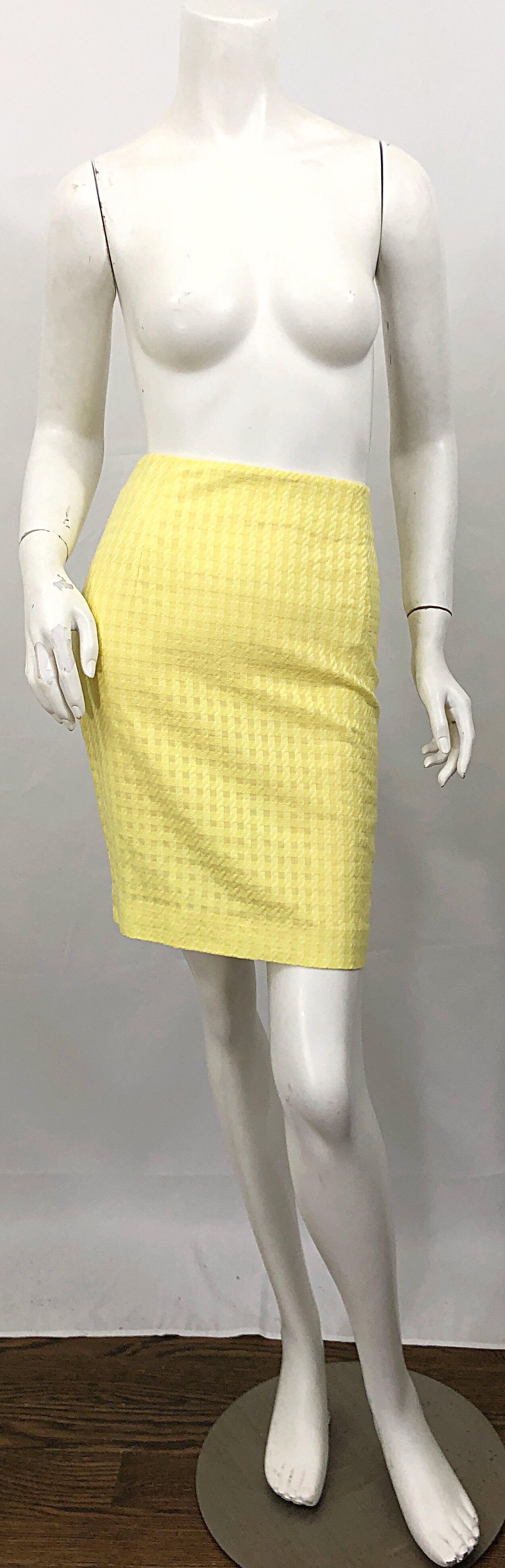 The perfect vintage 90s GIANNI VERSACE high waisted canary yellow cotton mini pencil skirt! Features a slightly textured check print in two similar shades of canary yellow. Vent at center back hem makes walking easier. Hidden zipper up the side with