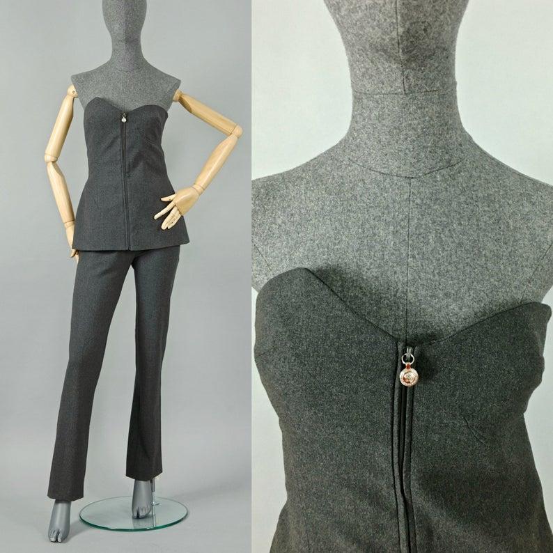 Vintage GIANNI VERSACE Asymmetric Bustier Tube Top Pants Trouser Suit

Measurements taken laid flat, please double bust, waist and hips:
BUSTIER TOP
Bust: 14.17 inches (36 cm) unstretched
Waist: 13.38 inches (34 cm)
Hips: 16.33 inches (41.5