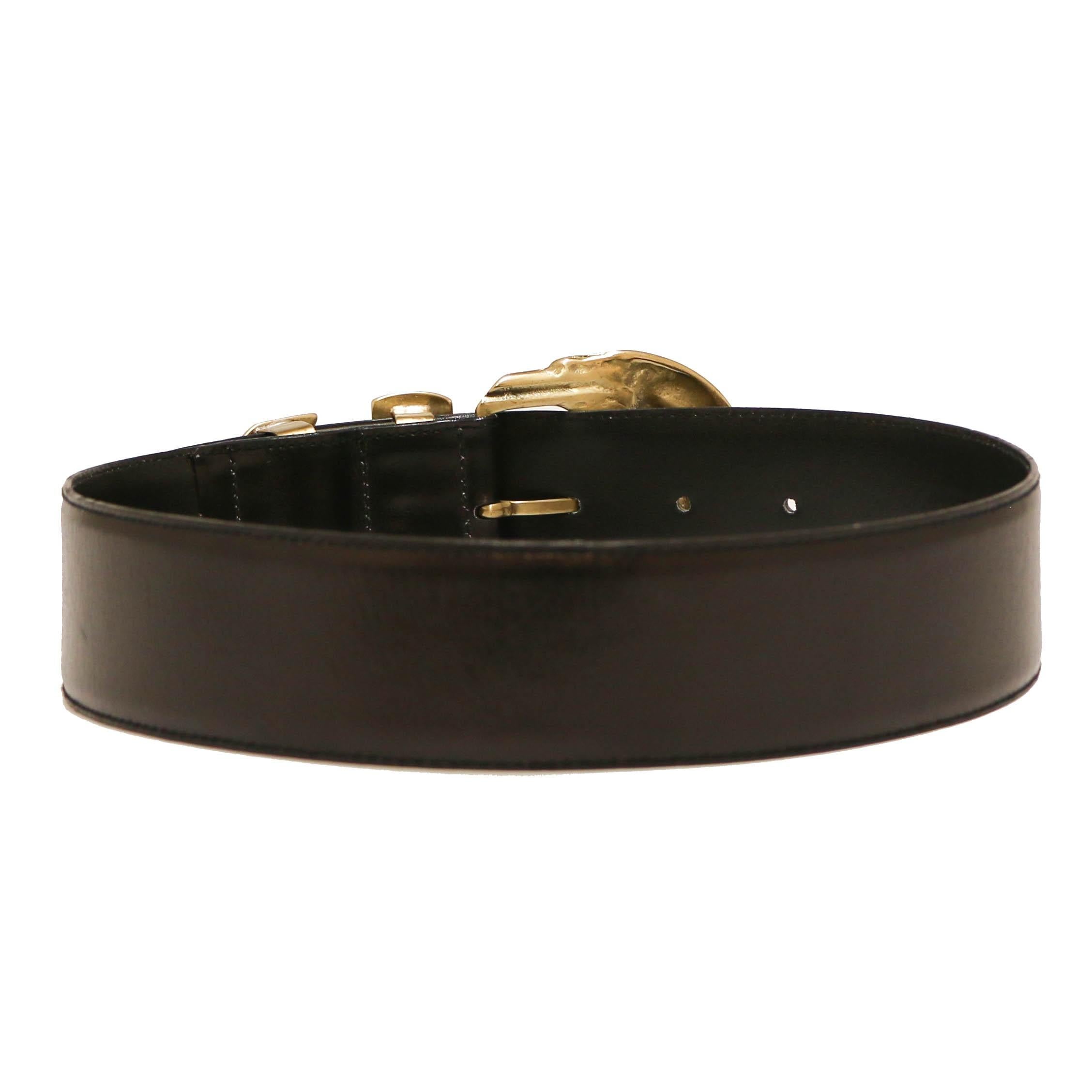 Exceptional! Vintage GIANNI VERSACE belt in black leather, hardware in gilt metal. The buckle is set with multicolors rhinestones (missing 2 rhinestones see photos).
In very good condition.
Made in Italy.
Size: 65
Length to 1st hole, last hole: 62 -