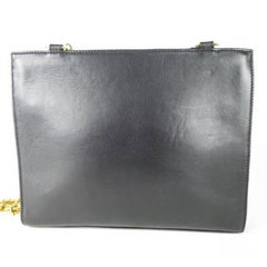 Vintage Gianni Versace black leather tote bag with big golden medusa motif. Rare