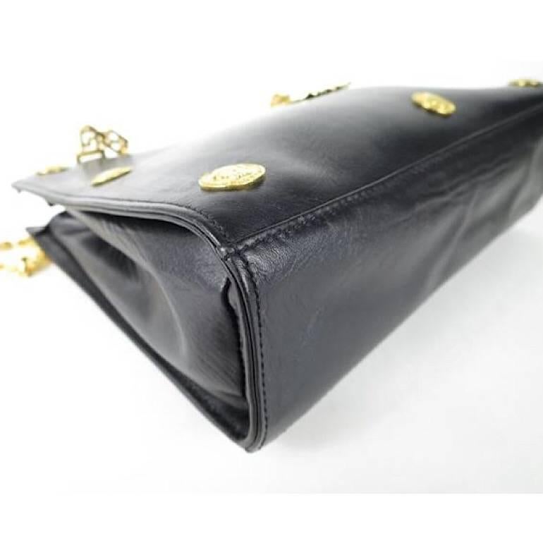 Black Vintage Gianni Versace black leather tote bag with big golden medusa motif. Rare For Sale