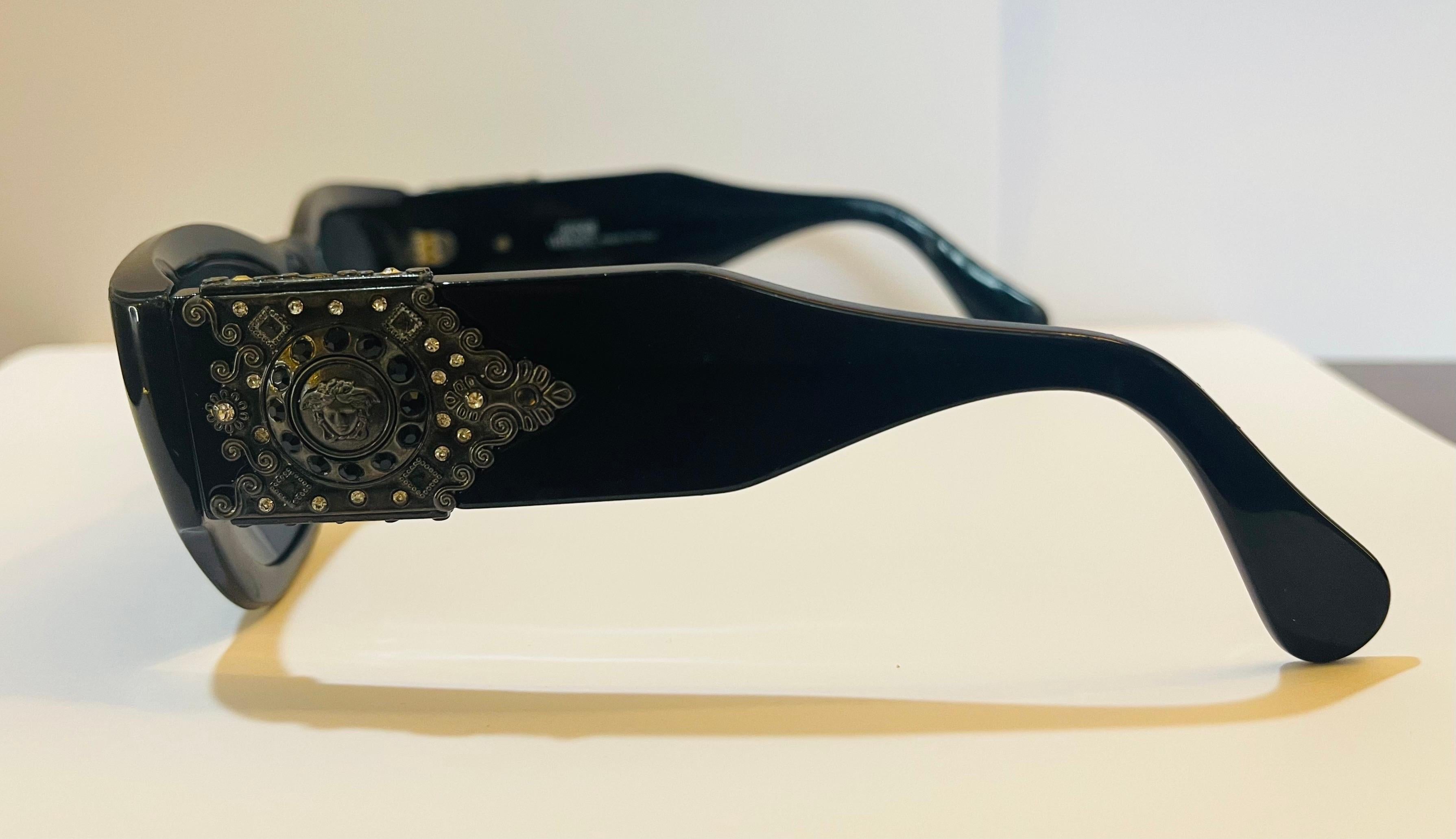 Extremely rare vintage Gianni Versace black sunglasses with iconic Medusa motif and rhinestones.