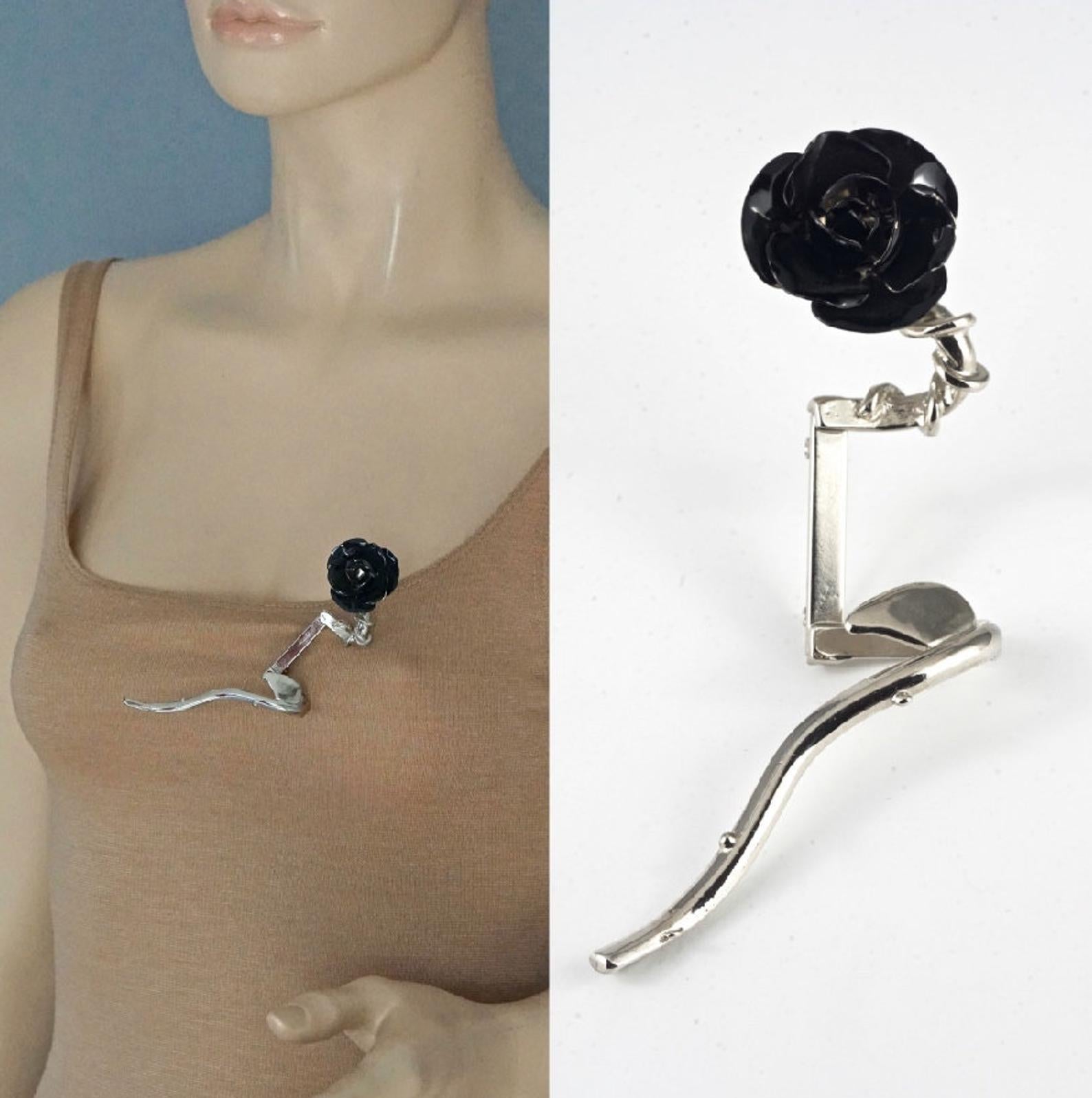 Vintage GIANNI VERSACE Black Rose Modernist Silver Brooch

Measurements:
Diameter of Rose: 1.18 inches (3 cm)
Total Length: 4.52 inches (11.5 cm)

Features:
- 100% Authentic GIANNI VERSACE.
- Black rose enamel brooch in modernist style.
- Silver