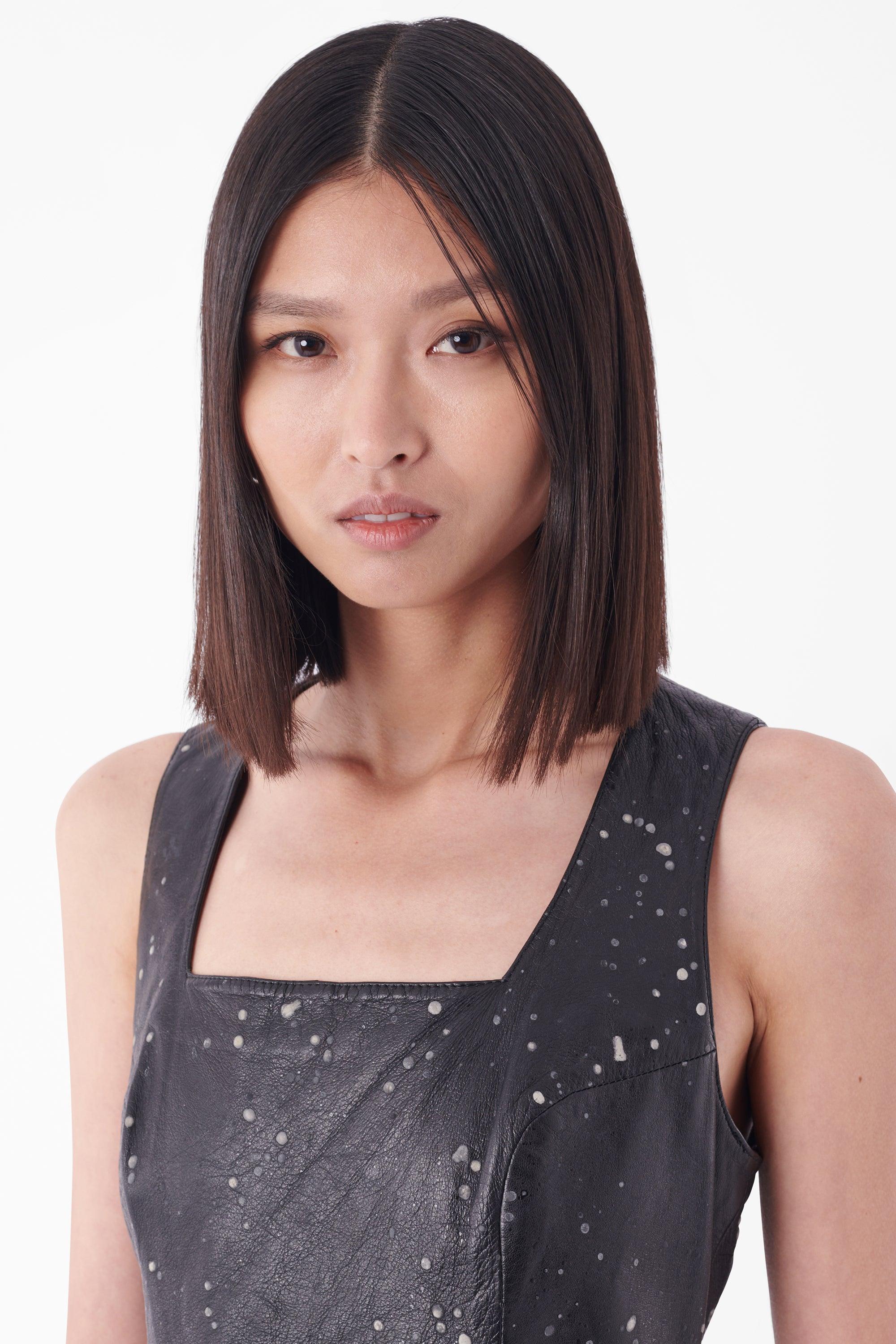 Versus by Gianni Versace black leather dress. Features square neckline, thick shoulder straps, 3D white print and back zip closure. In good vintage condition.
Authenticity Guaranteed

Modern Size: UK8: , US:4 , EU: 36
Fabric: Leather
Year / Season: