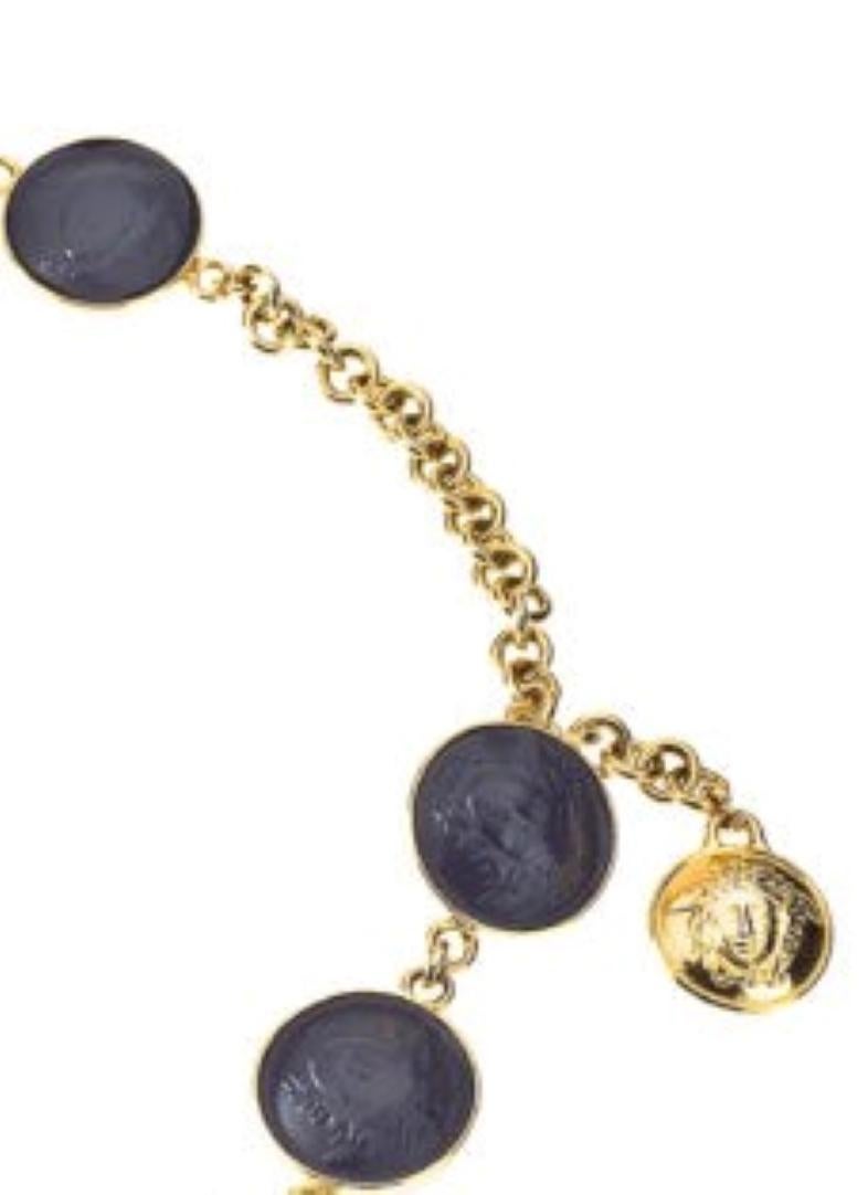 Description: Vintage Gianni Versace leather black/gold Medusa motif belt/necklace.

Specifications: Length:31 inches, width 1.3 inches
